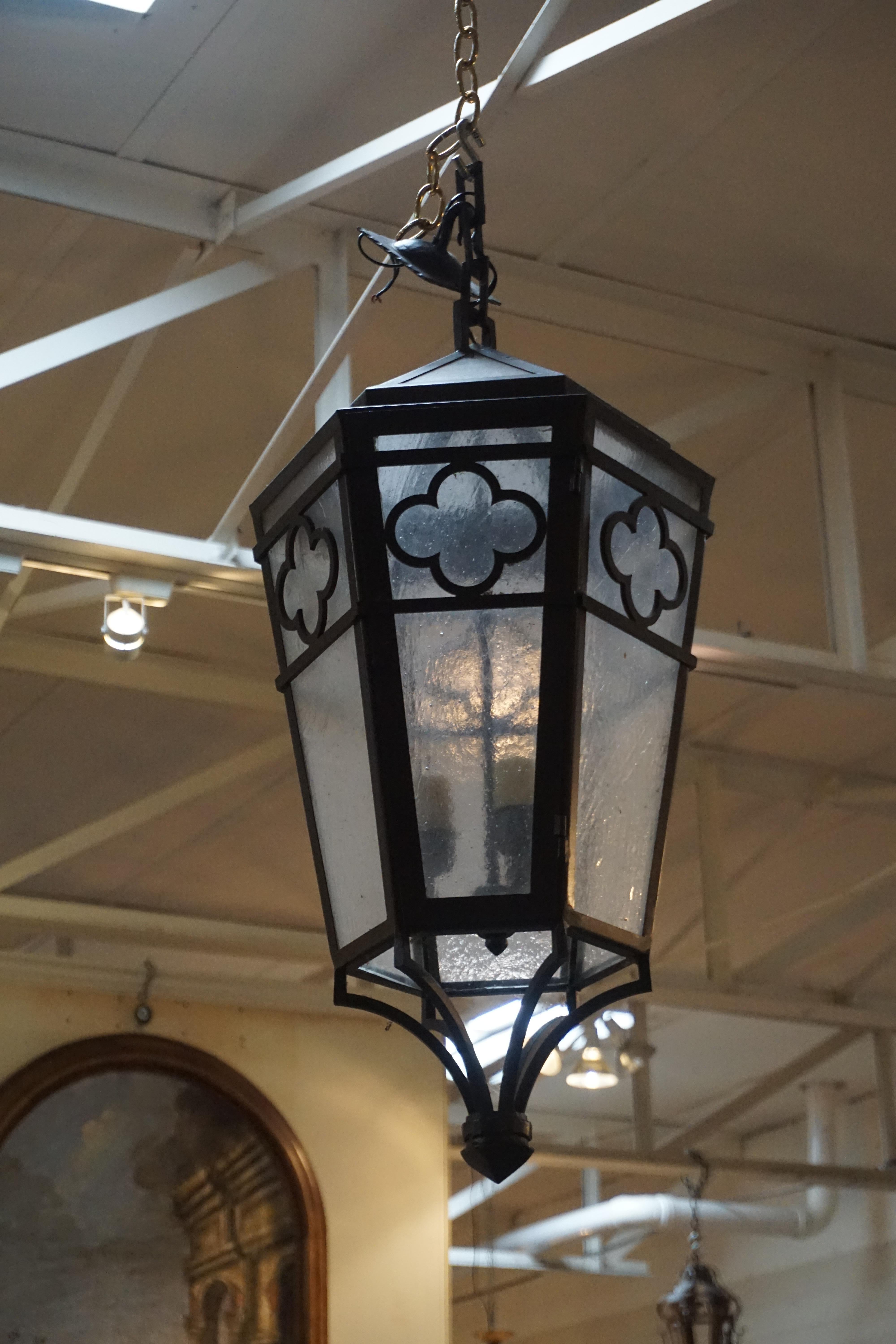 This hanging lantern features frosted glass for a soft glow and is wired, ready for install.

Measurements: 12'' D x 31'' H