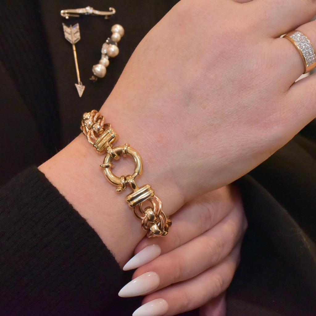 One of, if not the most spectacularly heavy, ever popular ‘Rollo’ style curb-link bracelet with double curb-links each connected with round belcher links which ‘roll’.

Crafted in very substantial fashion - 58 grams of solid 9ct gold! - in two-tone