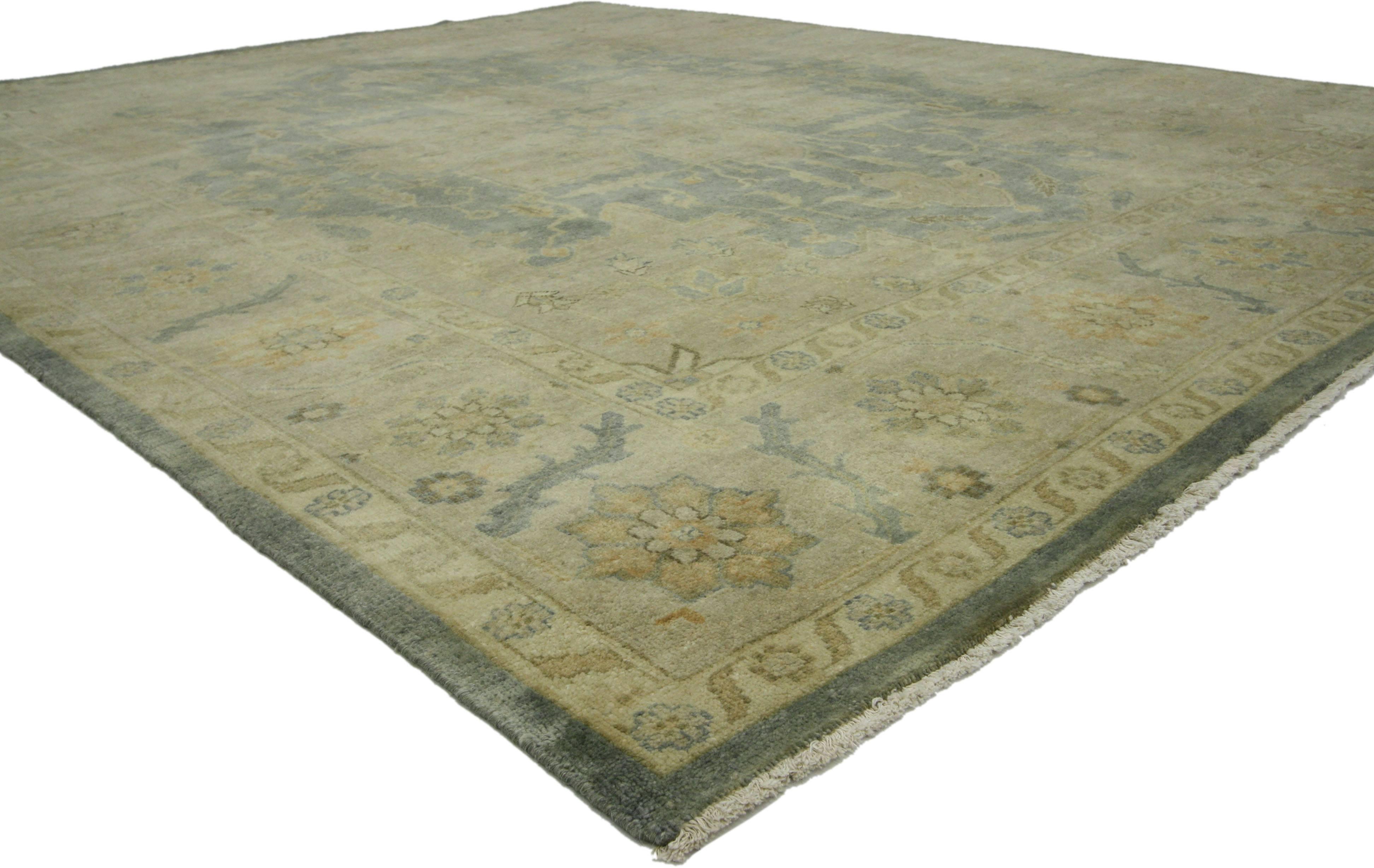 30177, contemporary Heriz style rug with neutral colors. This hand knotted wool contemporary Heriz-style rug features a large octofoil medallion with anchor pendants centered on an abrashed field. Delicate vinery, lanceolate leaves, rosettes, buds