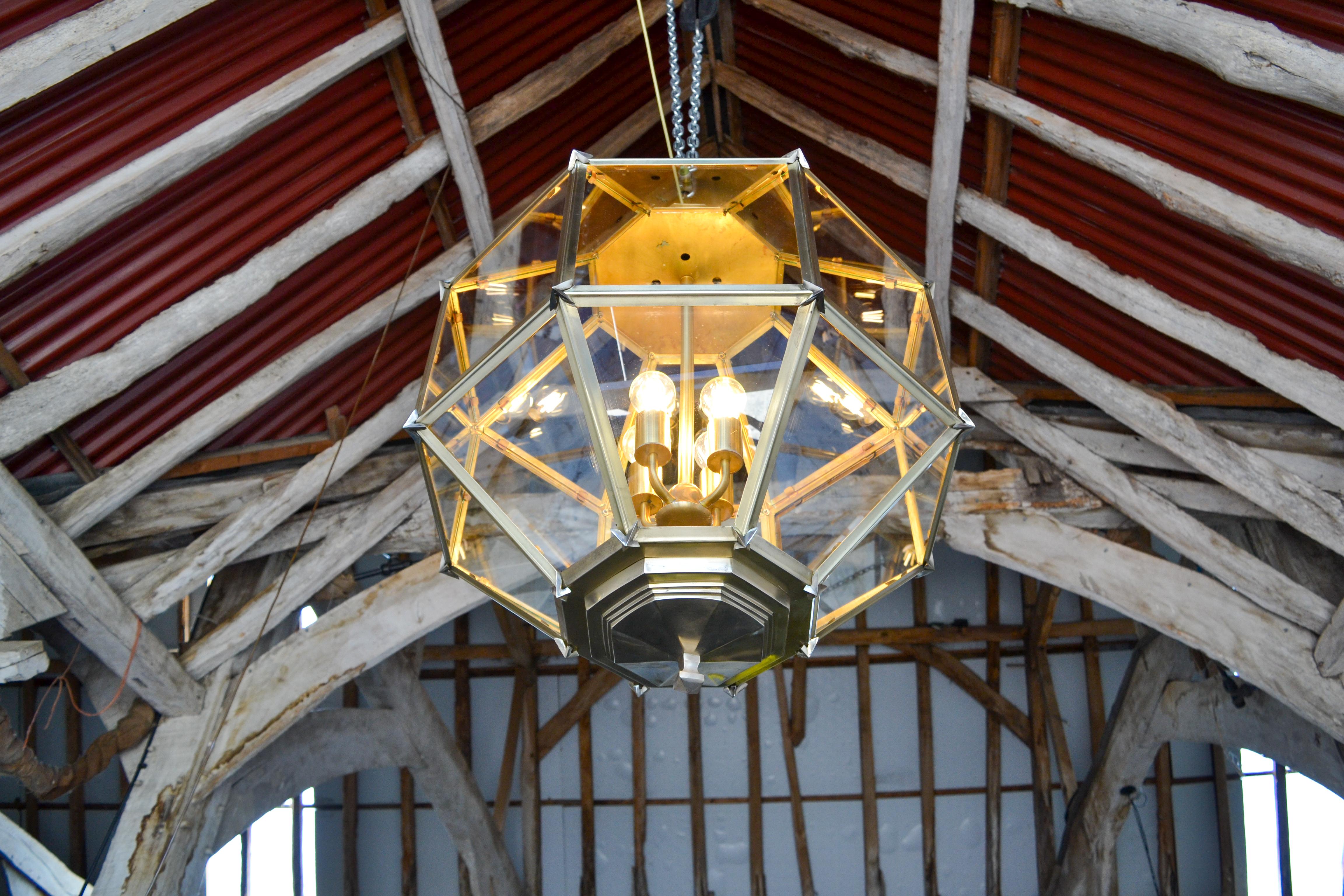Large solid brass hexagonal lantern with pierced flowers around the frieze. 