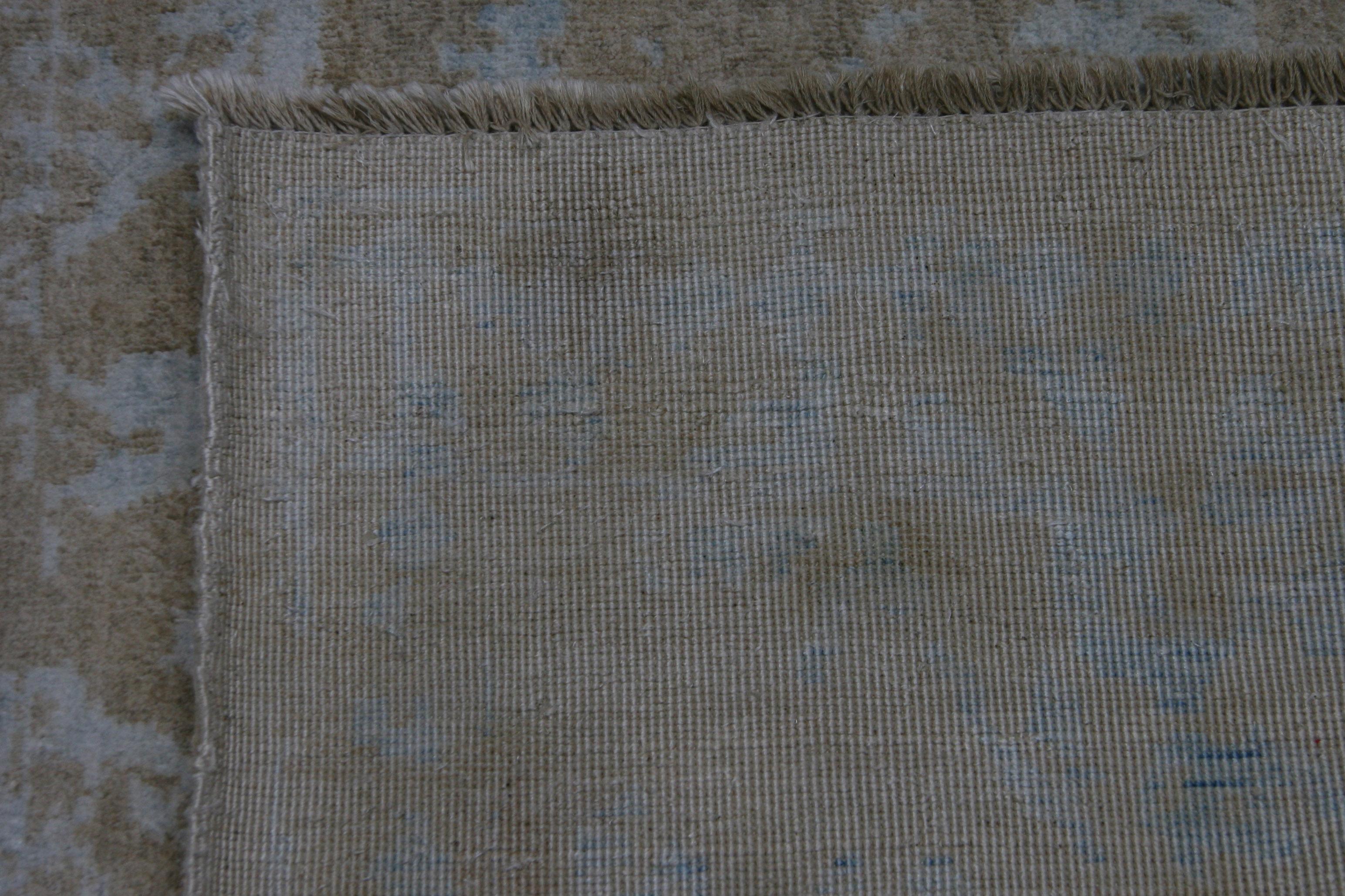 For those who appreciate traditional styles but want a more modern look comes a unique blend of traditional style and contemporary colors in a rug that brings texture as well. Taupe and teal. Vegetal dyes. Hand knotted in Pakistan. Wool.