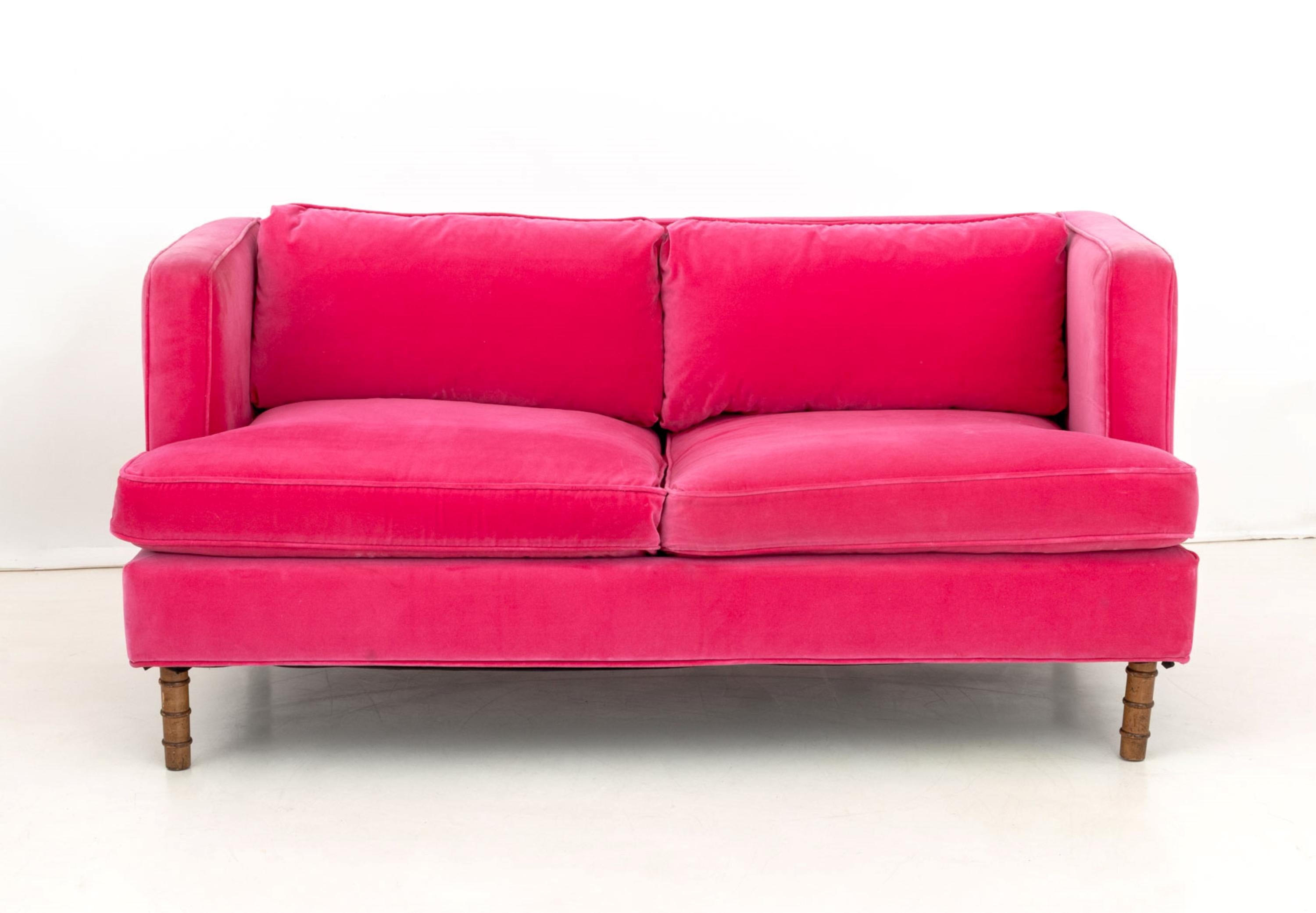 Contemporary Hot Pink Velvet Upholstered Loveseat, on four faux bamboo turned wood feet. 29