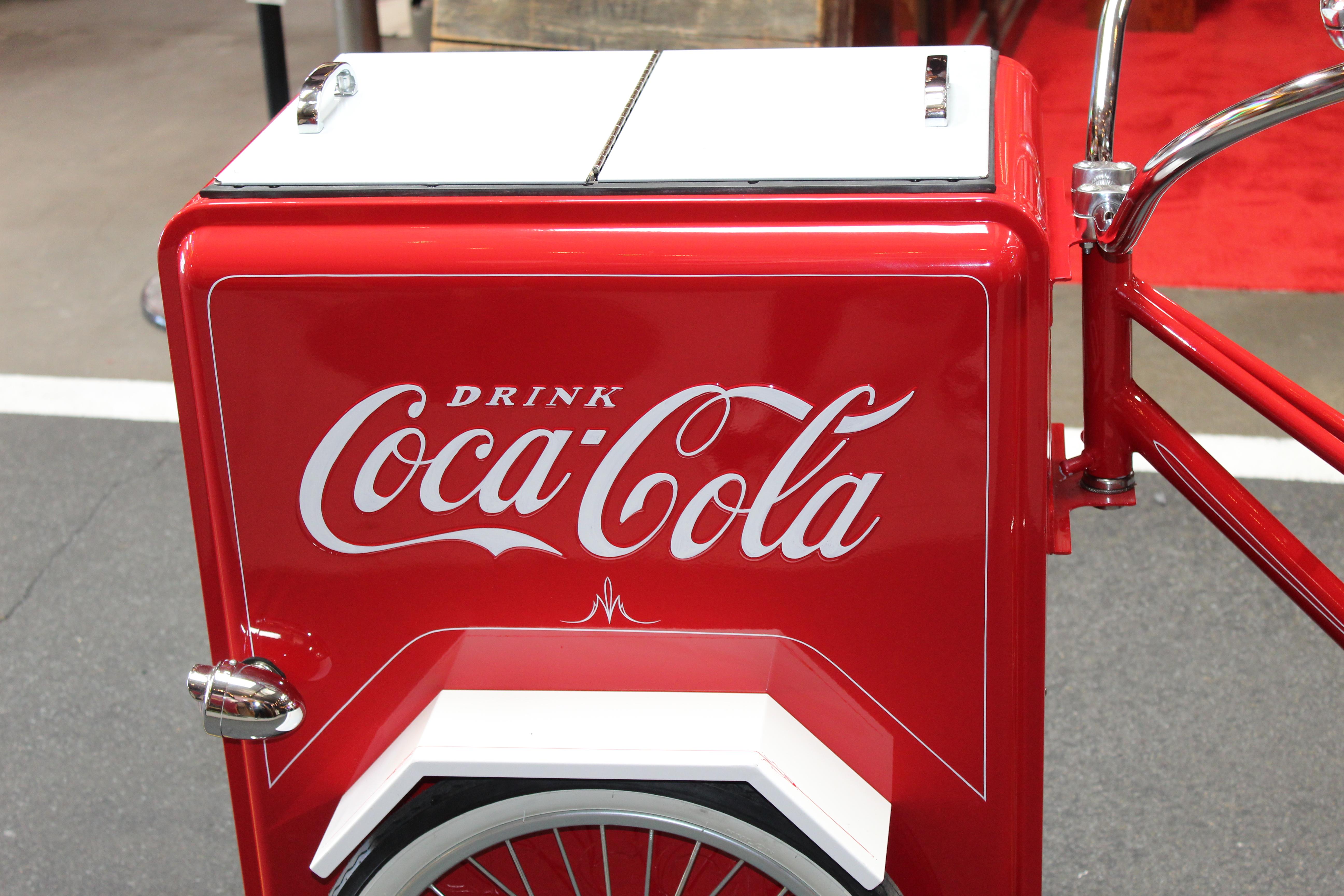 Amazing bicycle turned into Ice Chest. Complete coca cola theme. This is a reproduction item thats customized and hand built. Hand painted pin stripping. Rear fender has a small dent but over all bike in great condition.