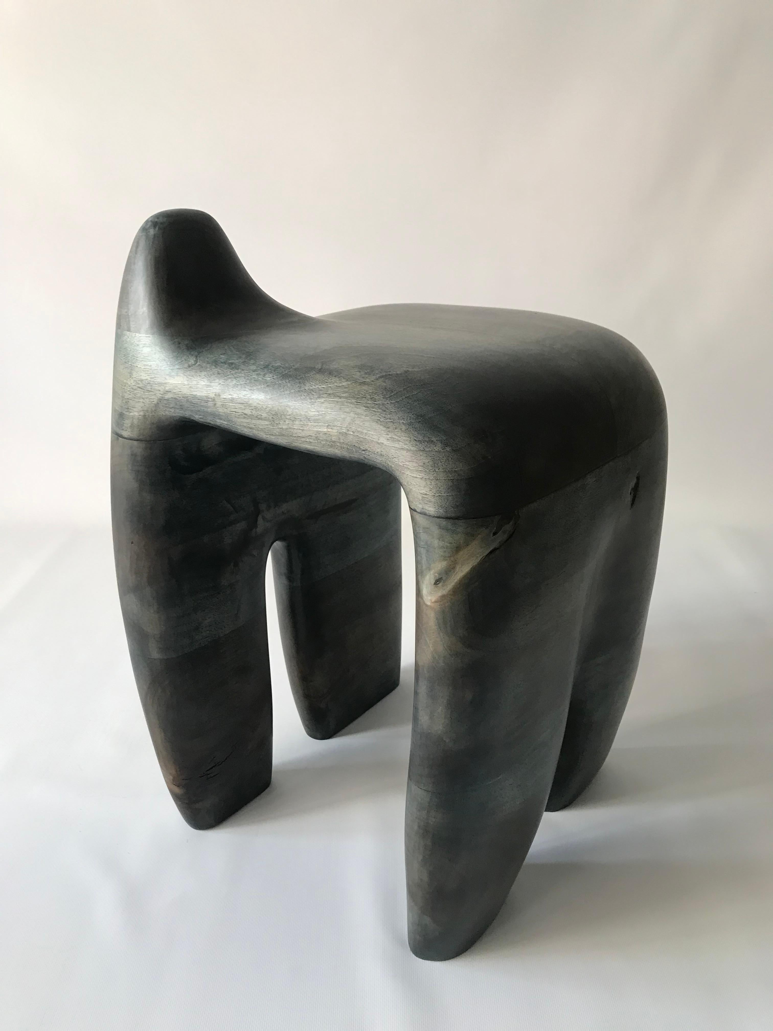 Jordi Sarrate is a product designer and sculptor based in Barcelona, Spain, and the third generation of furniture makers in his family.

The gallery presents 'Jeans' collection sculpted on Iberian walnut wood and finished with indigo blue patina.
