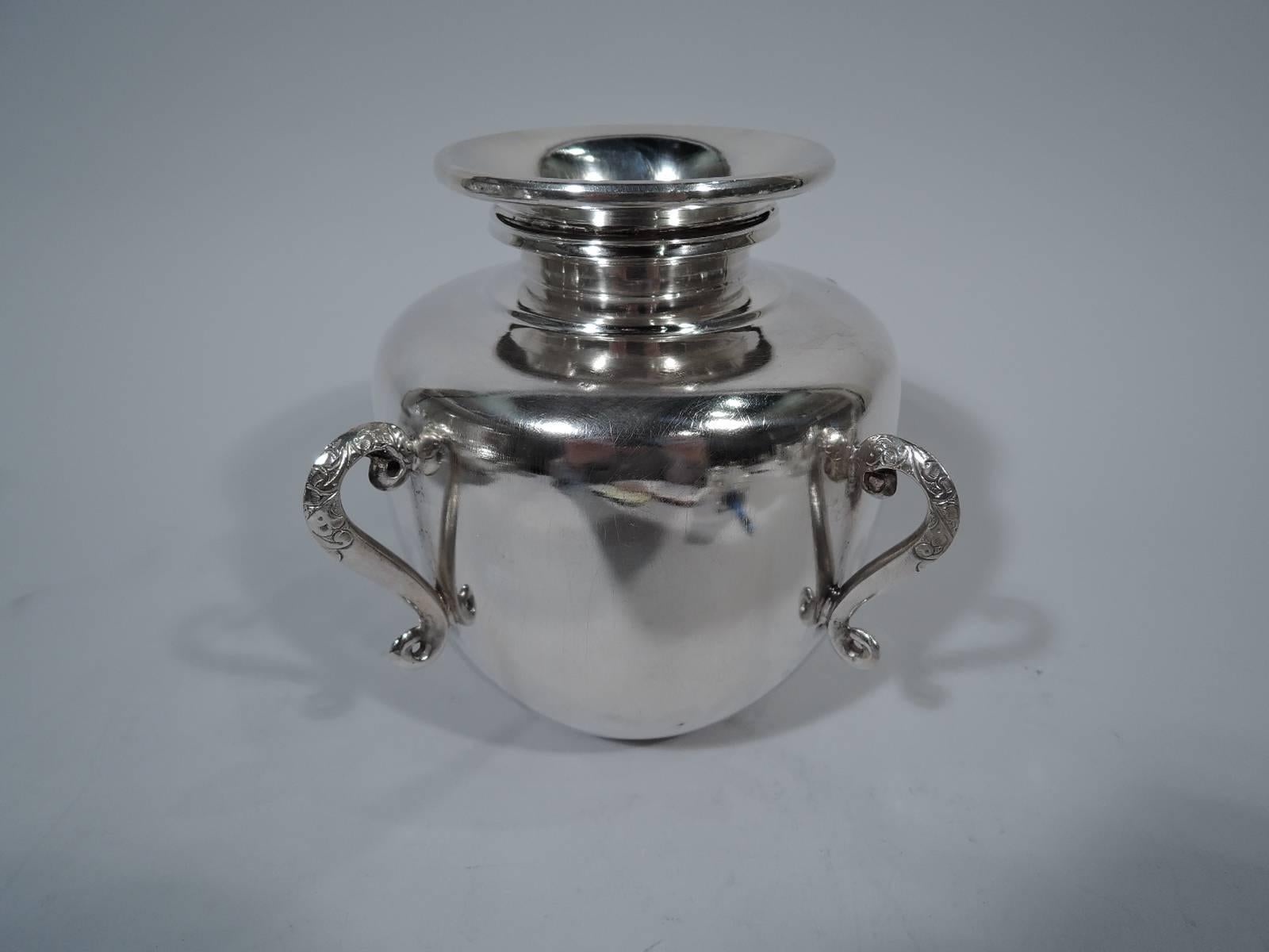 Contemporary sterling silver vase in form of traditional pot. Made by Miss India in Jaipur, India. Curved sides, round shoulders, short neck, and wide mouth. Four S-scrolls with tooled ornament mounted to sides. A fine adaptation of an earthenware