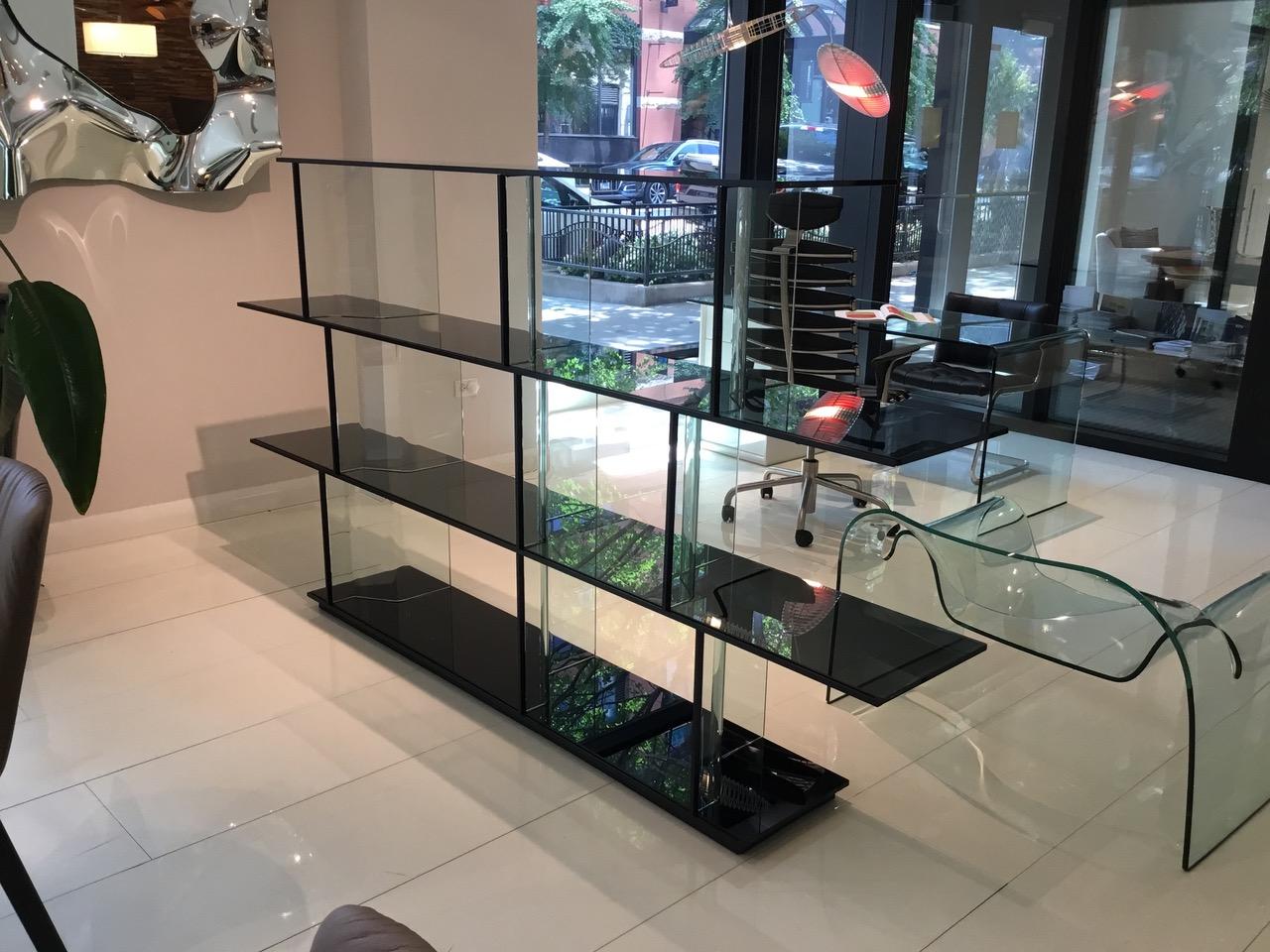 The Inori modular bookcase, designed for Fiam by Setsu & Shinobu Ito, is the first system in the furniture industry entirely made of glass, and composed of modular elements.

Showroom display in good condition. Bookcase in a combination of black,