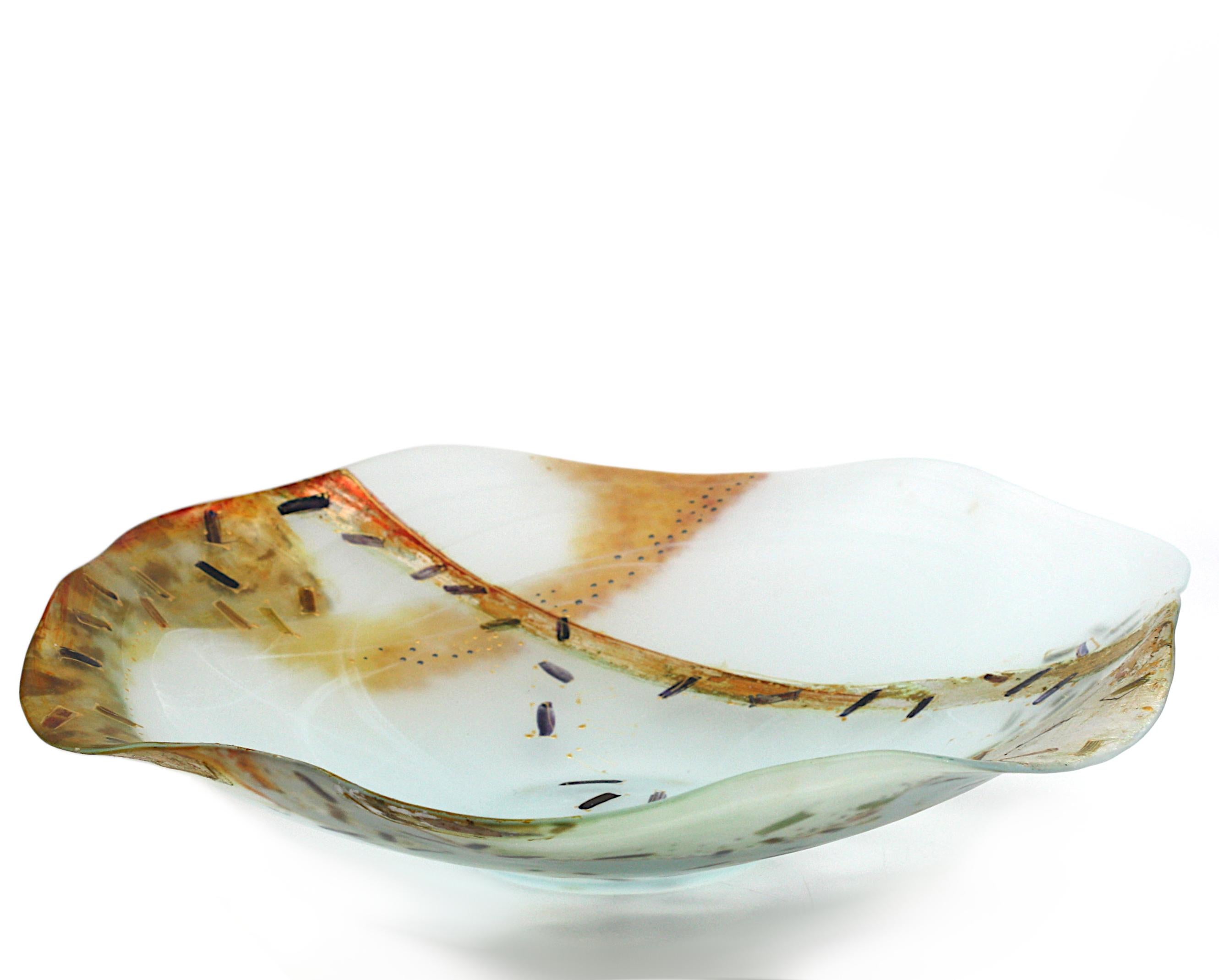 
Contemporary Internally Decorated Frosted Glass Bowl
Unsigned. The asymmetrical bowl decorated internally with white whisps and purple décor, the exterior with areas of gilt and silver.
Height 3 in., Diameter 17 in.
Condition Report
Good condition