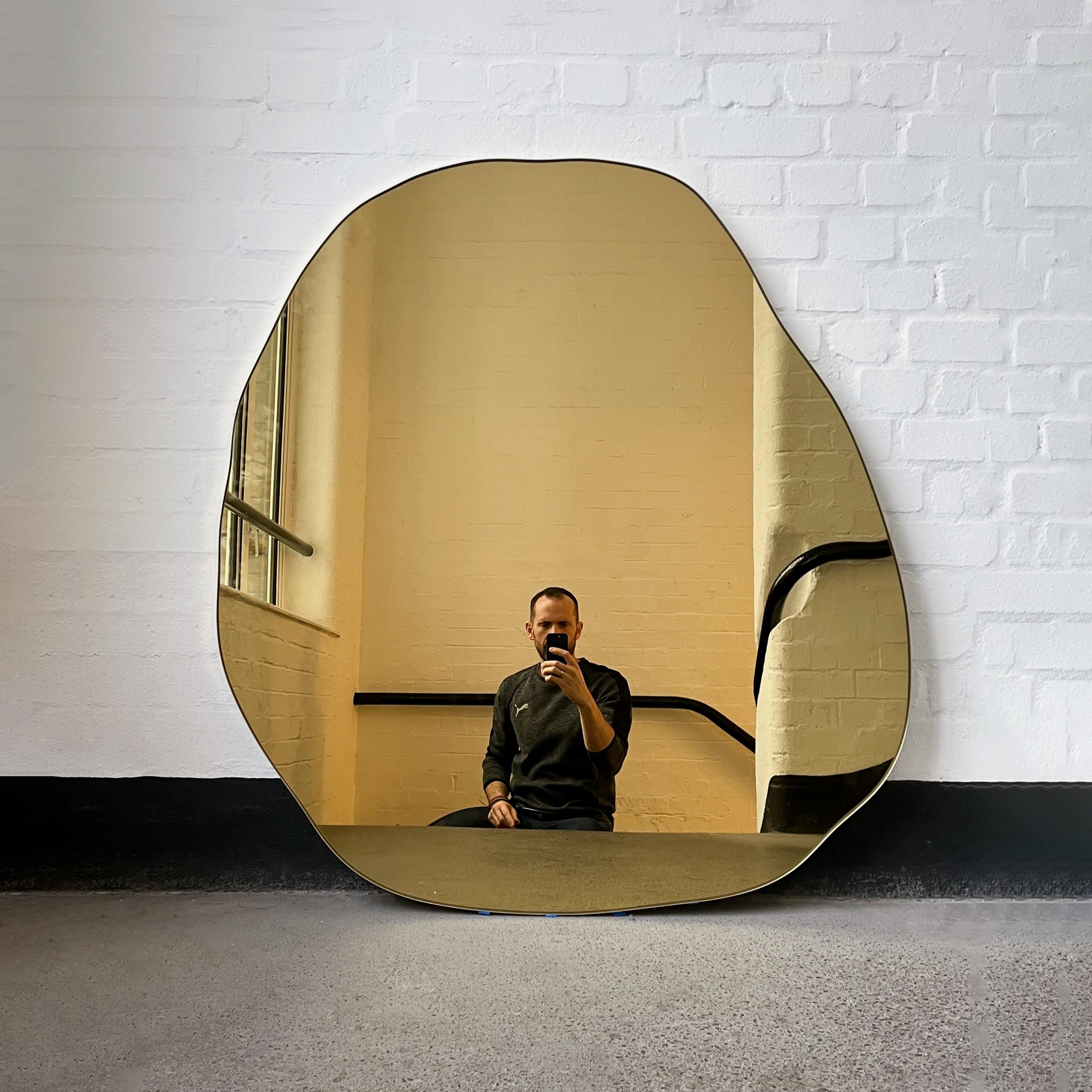 Polished Contemporary Irregular Freeform Gold Tinted Mirror with Brass Frame, Oversized For Sale
