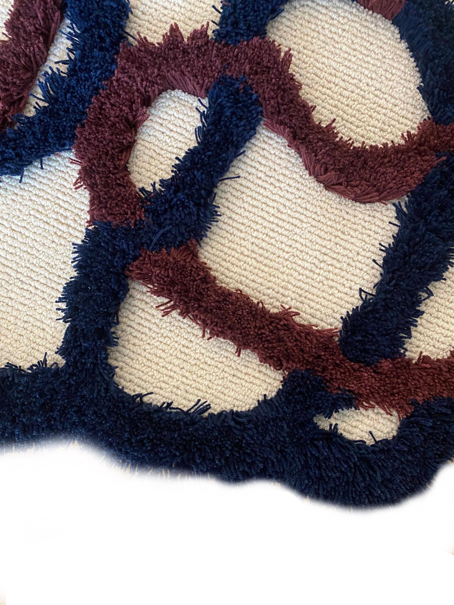 'Crosses Circulation' 
Contemporary irregular shape shaggy maroon blue and beige rug '' by RAG Home

Original Designed by RAG Home Jakarta
Hand-tufted carpet with mixed carving embossed methods and colours. 
It can be customised in size. Made by