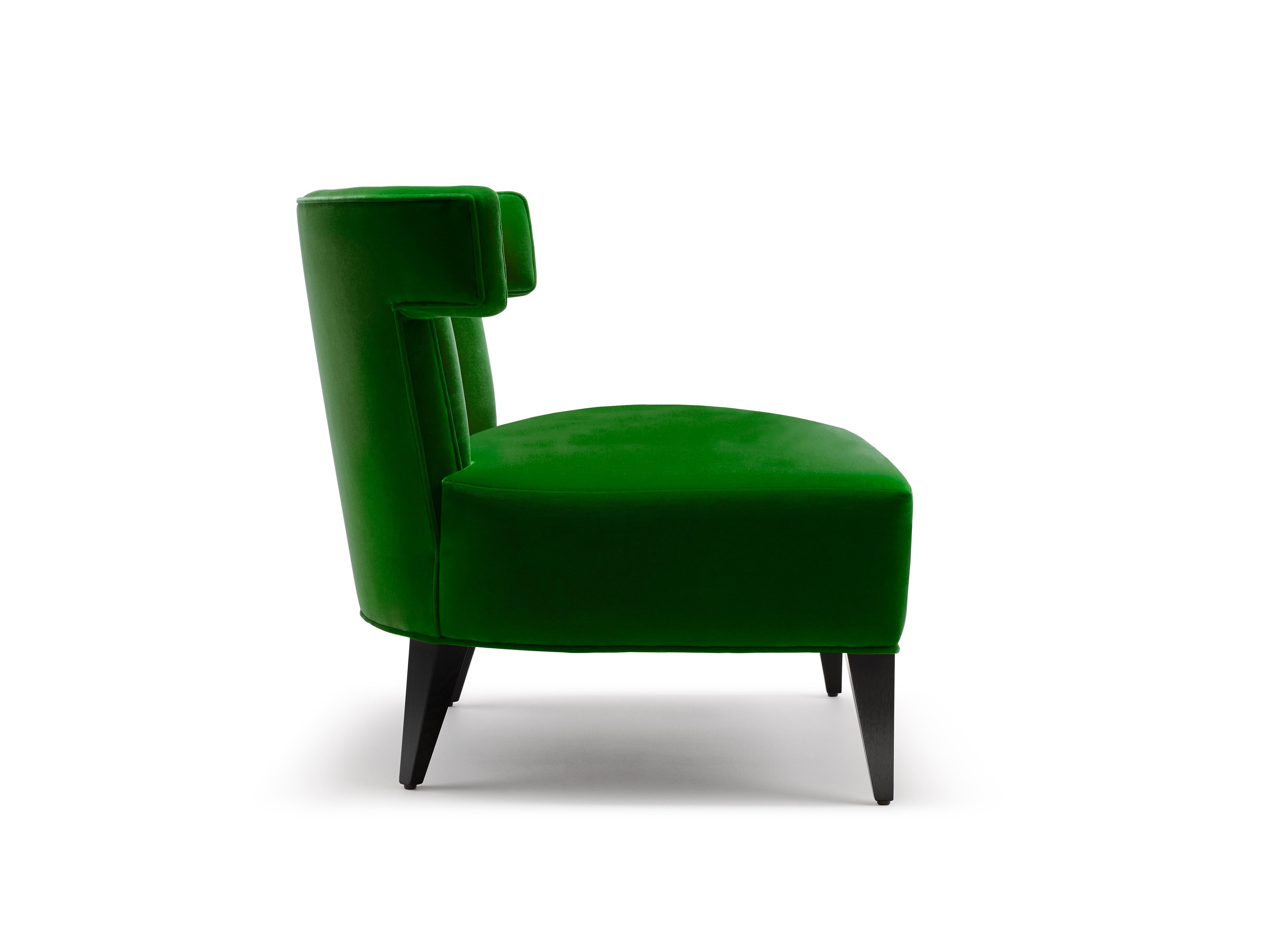 The Isabella slipper chair is one of our signature pieces. The exquisite tailored fluting and distinctive lines give a shapely feminine edge. This design is superb upholstered in a vibrant cotton velvet. Shown here upholstered in Emerald Green