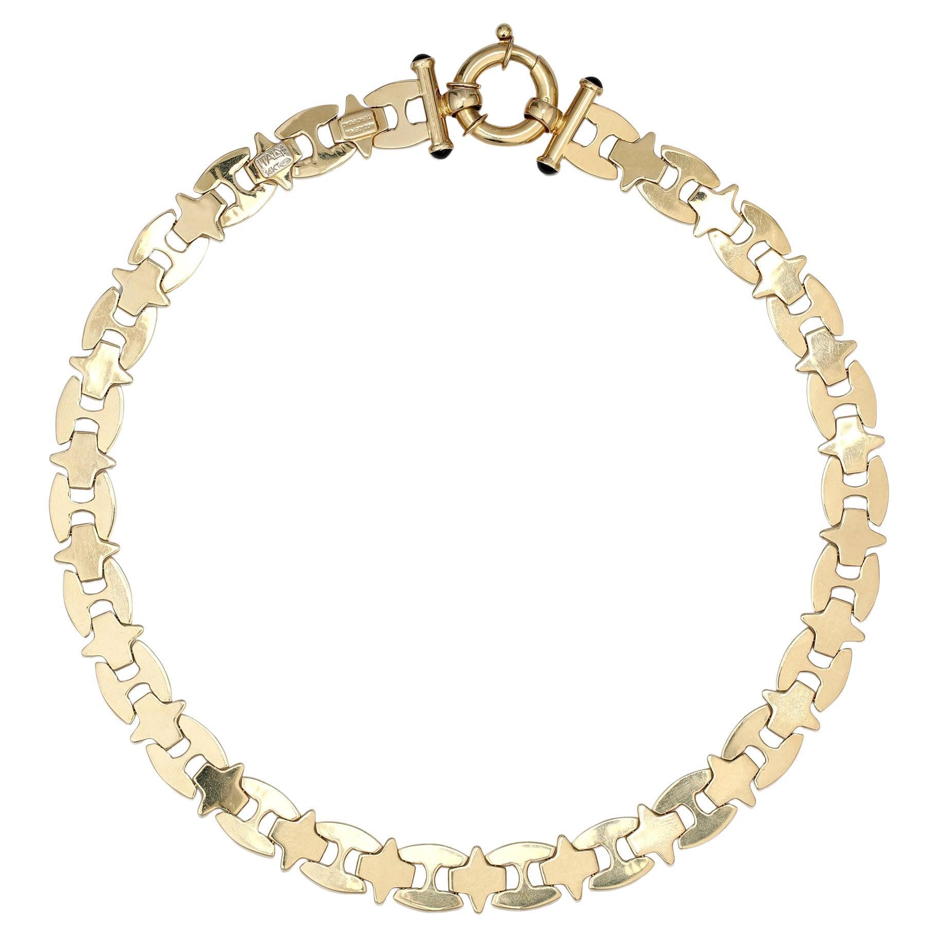 A superb and sexy gold collar necklace for making a great – and unforgettable – first impression! The neck-hugging 42cm anchor chain is crafted in gleaming 14ct yellow gold with alternating smooth and brushed-finished links. Two onyx cabochons sit