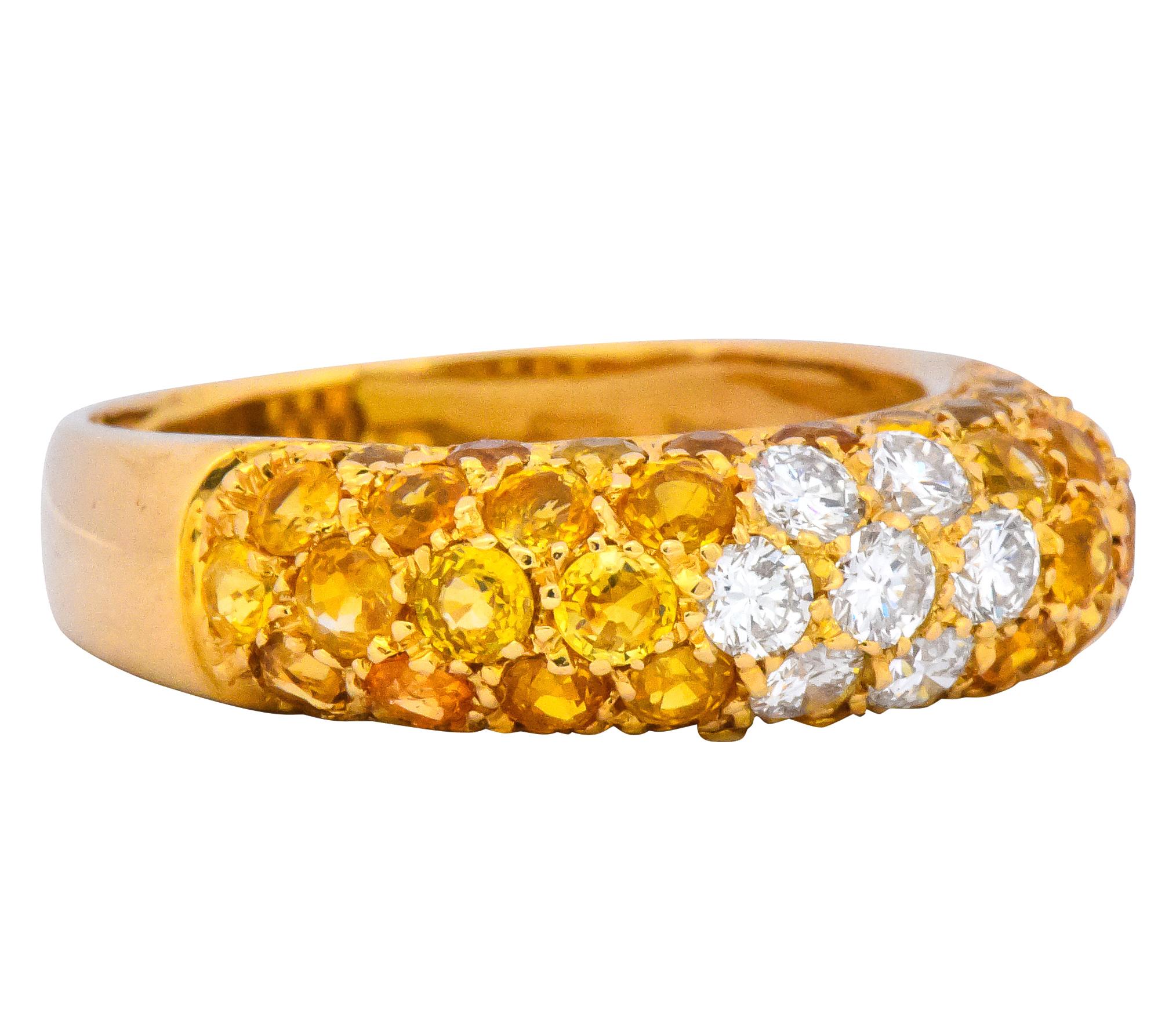 Set to the front with pavé set round brilliant cut diamonds and yellow sapphires

Centering round brilliant cut diamonds weighing approximately 0.55 carat, G to H color and VS to SI clarity

Accented by round brilliant cut yellow sapphires, weighing