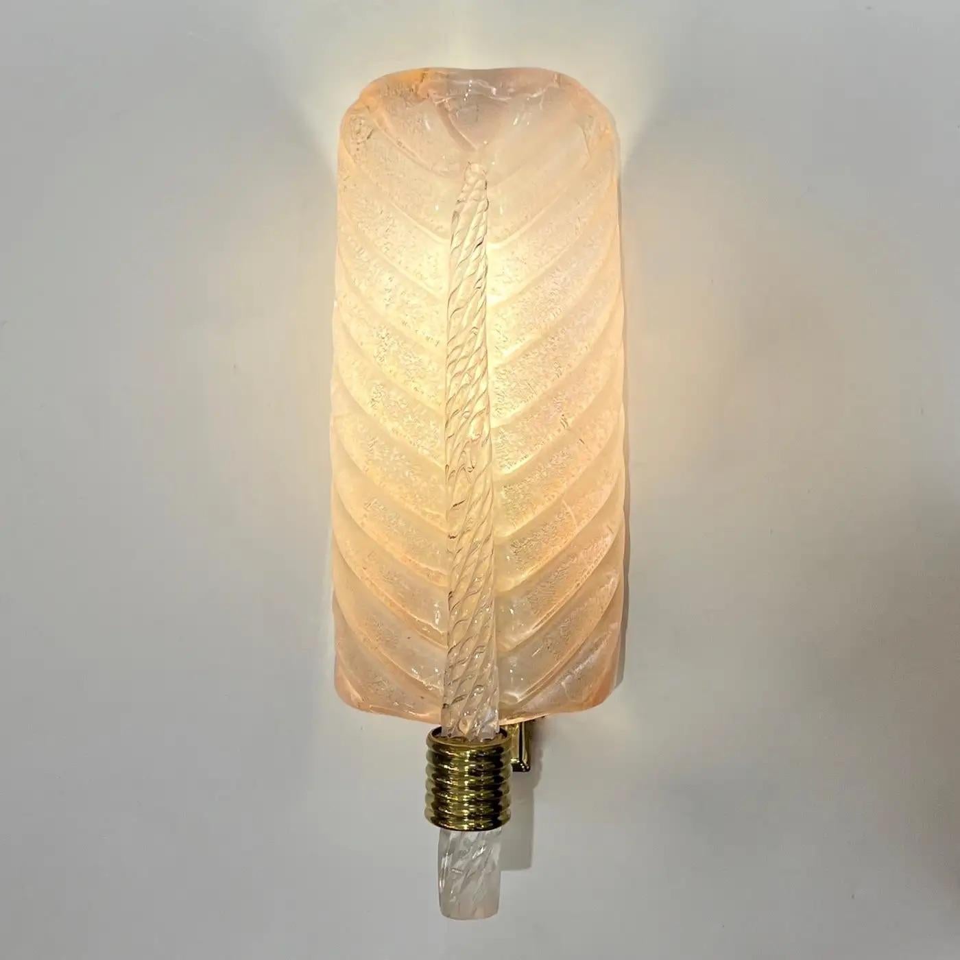 Exquisite pair of bespoke wall lights in blown Murano glass in the style of Barovier, with an organic Art Deco design feather leaf curved shape. Entirely handcrafted in Italy, the high-quality Murano glass has a blush pink pearl luminosity given by