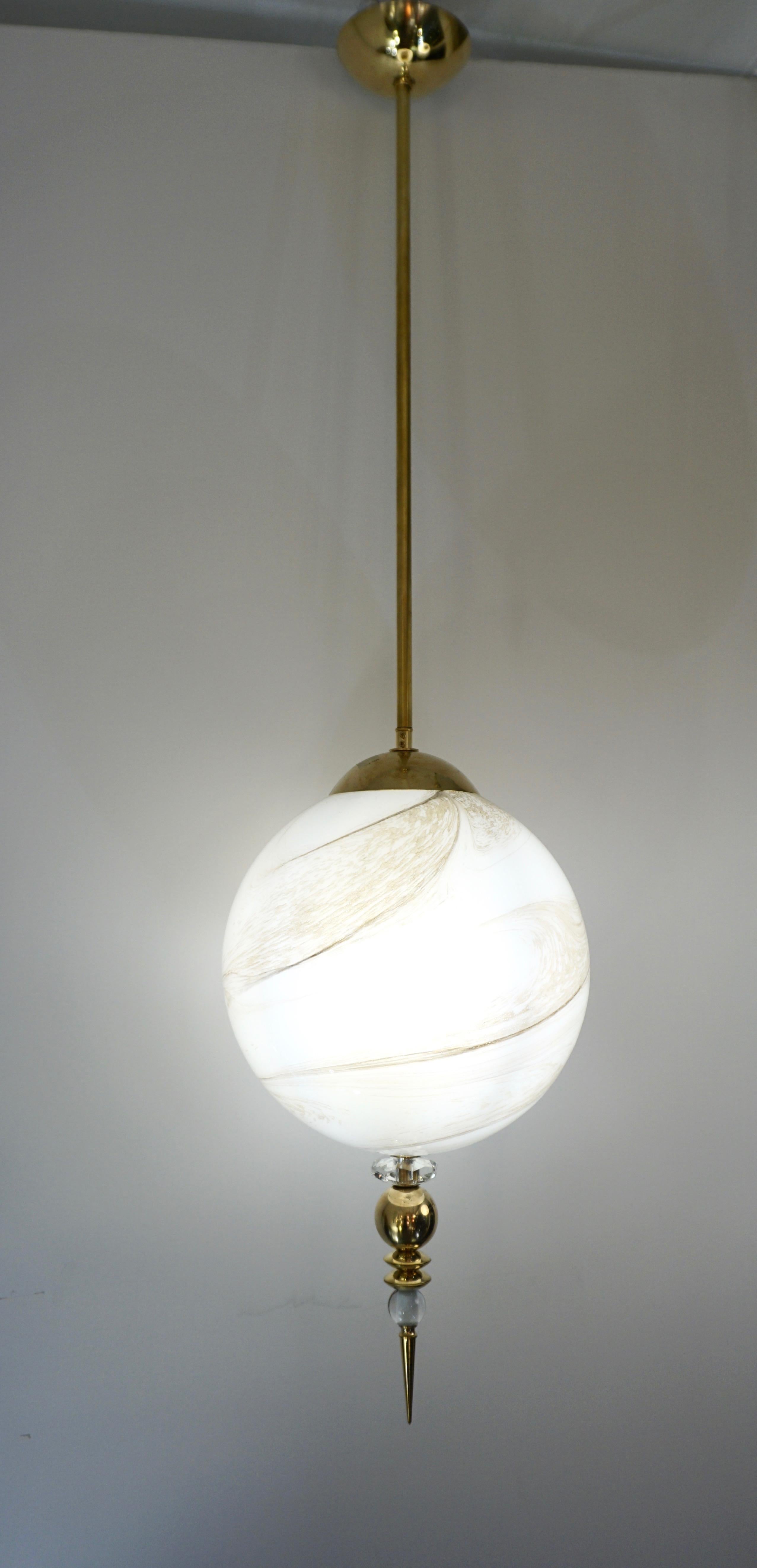 A modern round globe pendant chandelier of a geometric organic series, entirely handcrafted in Italy, the sphere in an innovative blown Murano glass to resemble alabaster with the benefit to be lighter and to remain over time of the same translucent