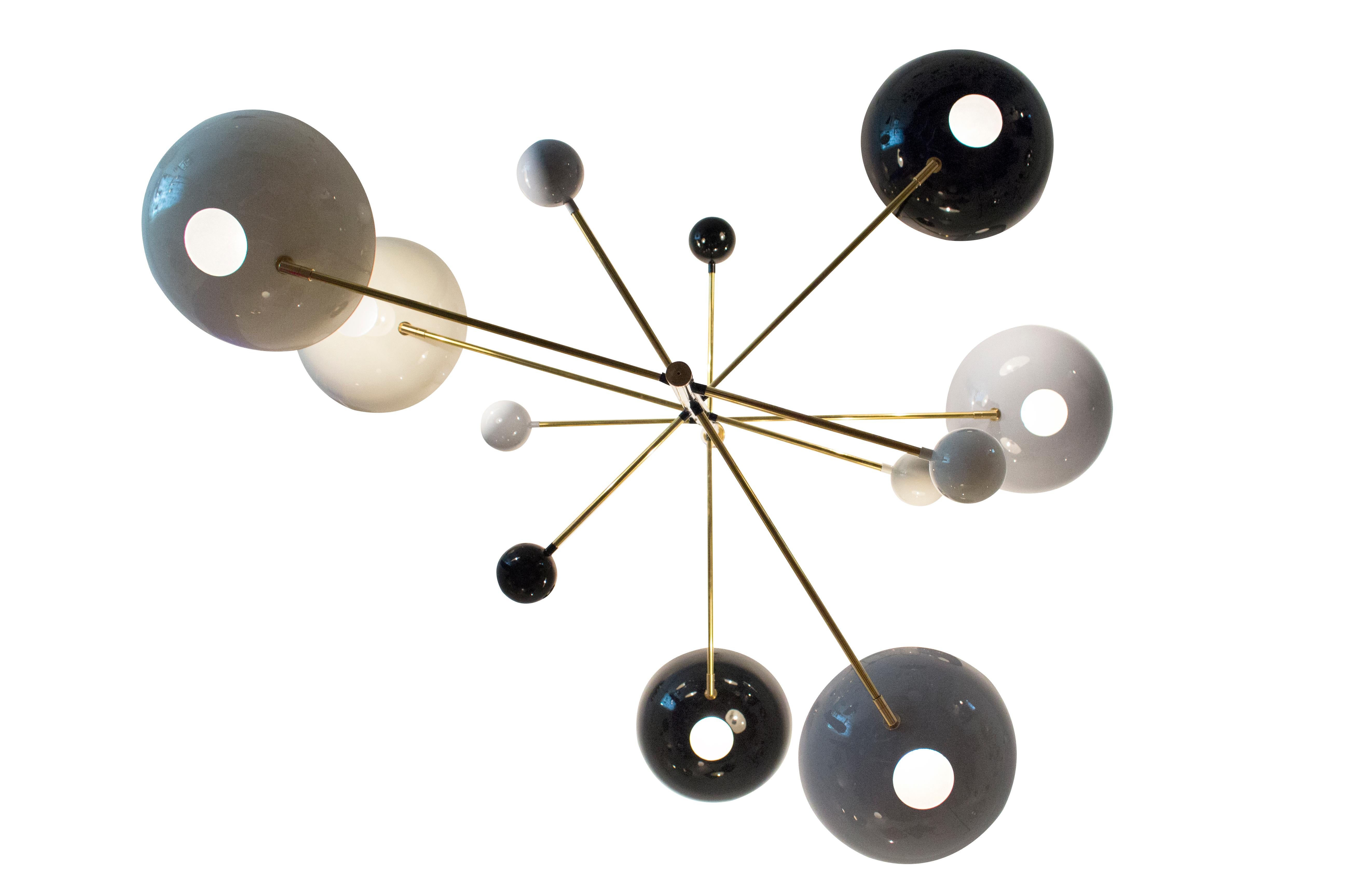 Cascading ceiling light

Brass frame

Colored enamel saucer shaped shades and balls

Contemporary

Made to order in Italy.