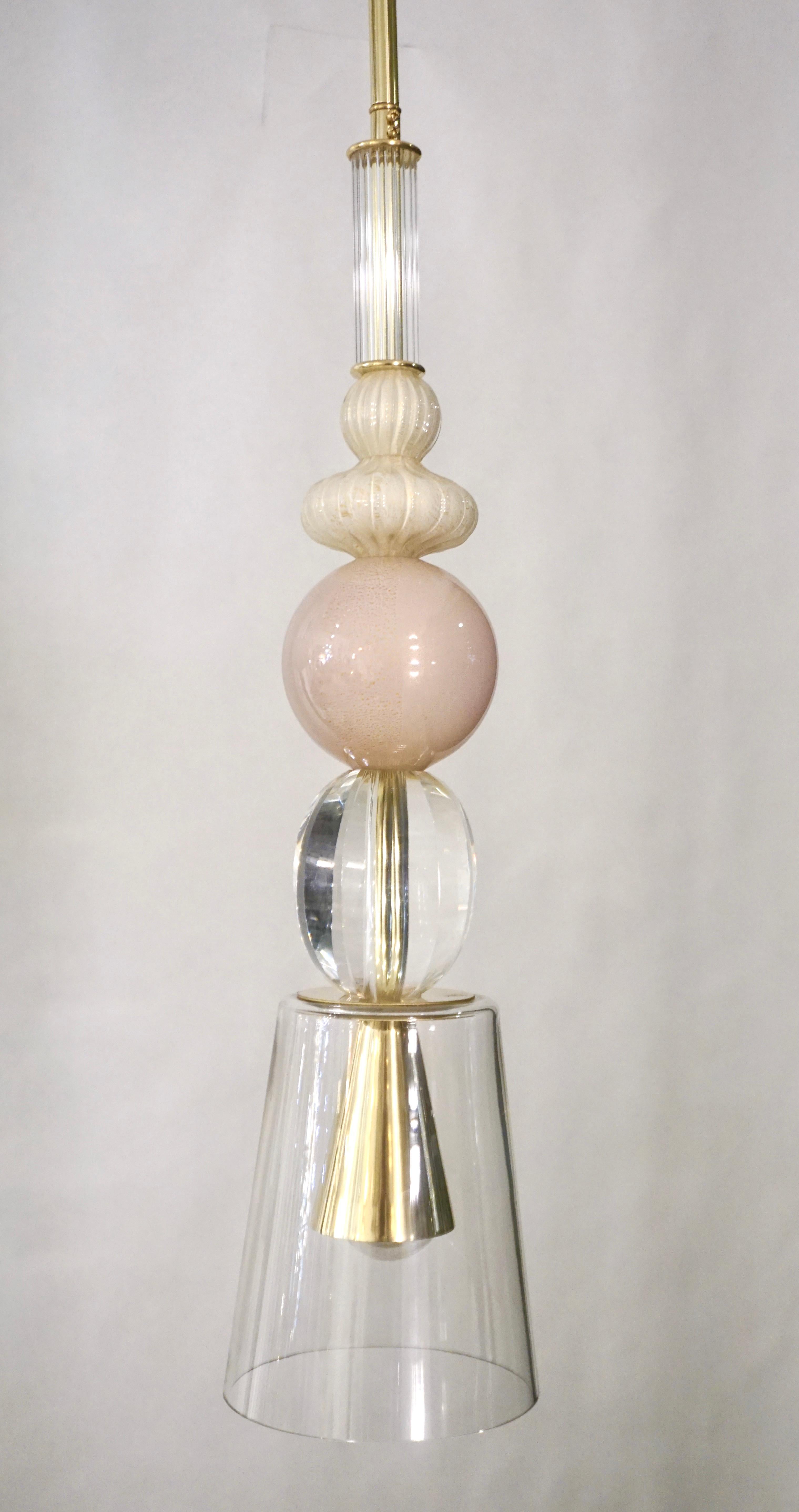 Fun and elegant Italian lantern pendant chandelier, entirely handcrafted, of organic modern design consisting of a succession of elements: reeded crystal Murano glass cylinder, opaline cream glass spheres overlaid in clear crystal worked with
