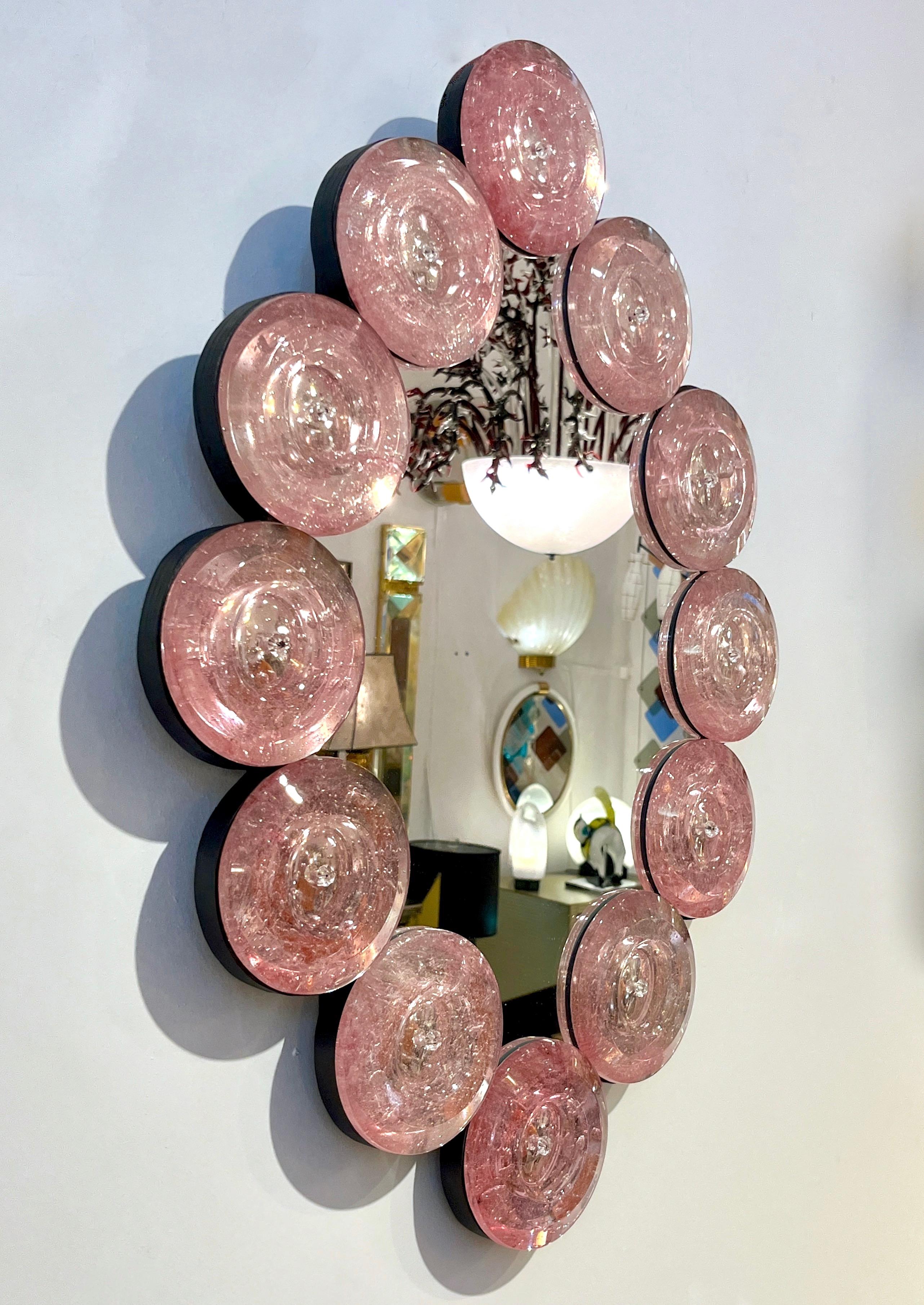 A fun decorative sculpture mirror that brings light and color to your interiors! Contemporary Italian Custom Murano Glass Disk Mirror in a modern oval tear-drop shape Design, vertical or horizontal. The mirror frame is composed of 12 Murano glass