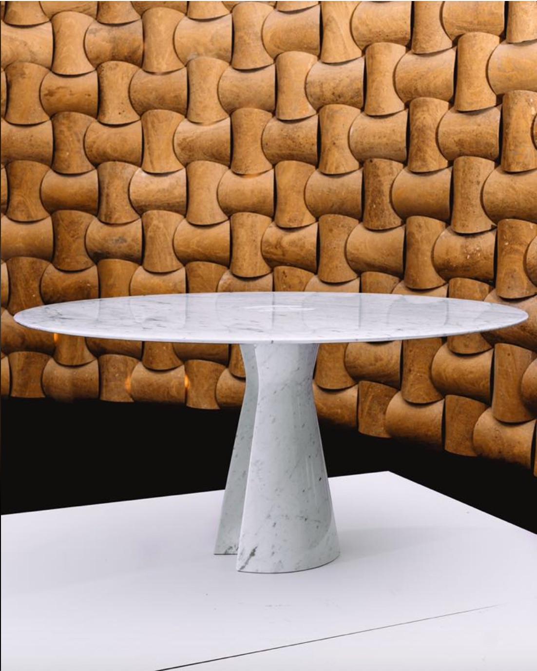 This contemporary Italian table is designed by Norman Foster and has two basic elements: a highly polished marble top with a singular sculpted free-form support of the same material. Hadrian has a robust shape in the form of an oblong cylinder that