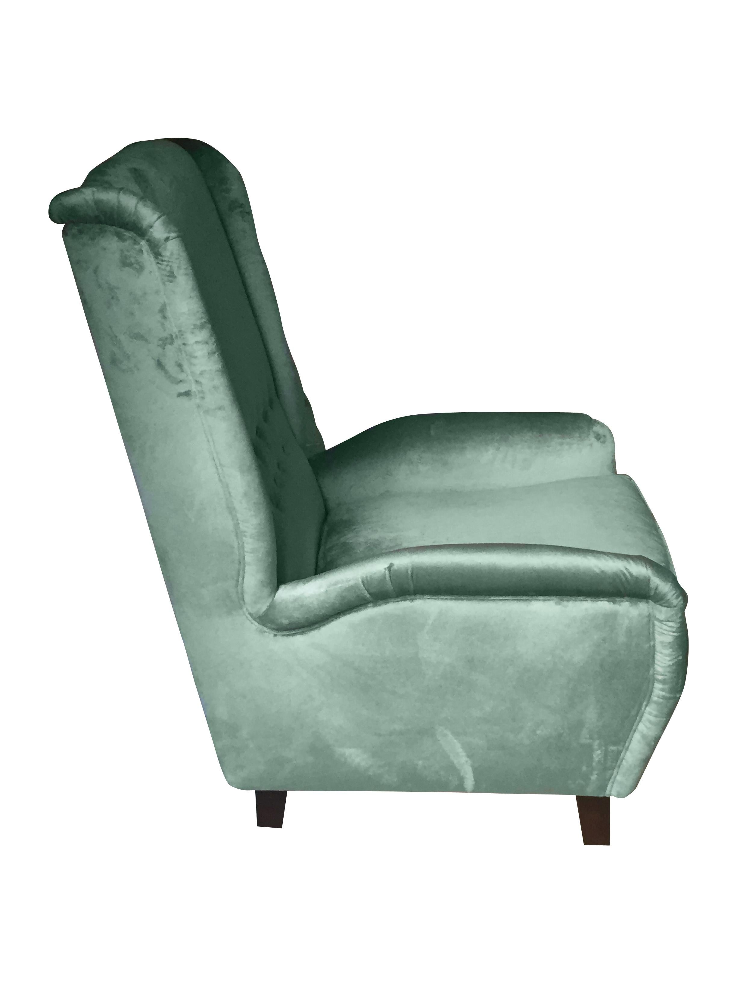 Very comfortable high back armchair, entirely handcrafted in Italy, a statement of elegance and modern Italian Design, with clean cut curved lines, elegantly indented sides, slightly embracing button-tufted back, raised on wooden legs and