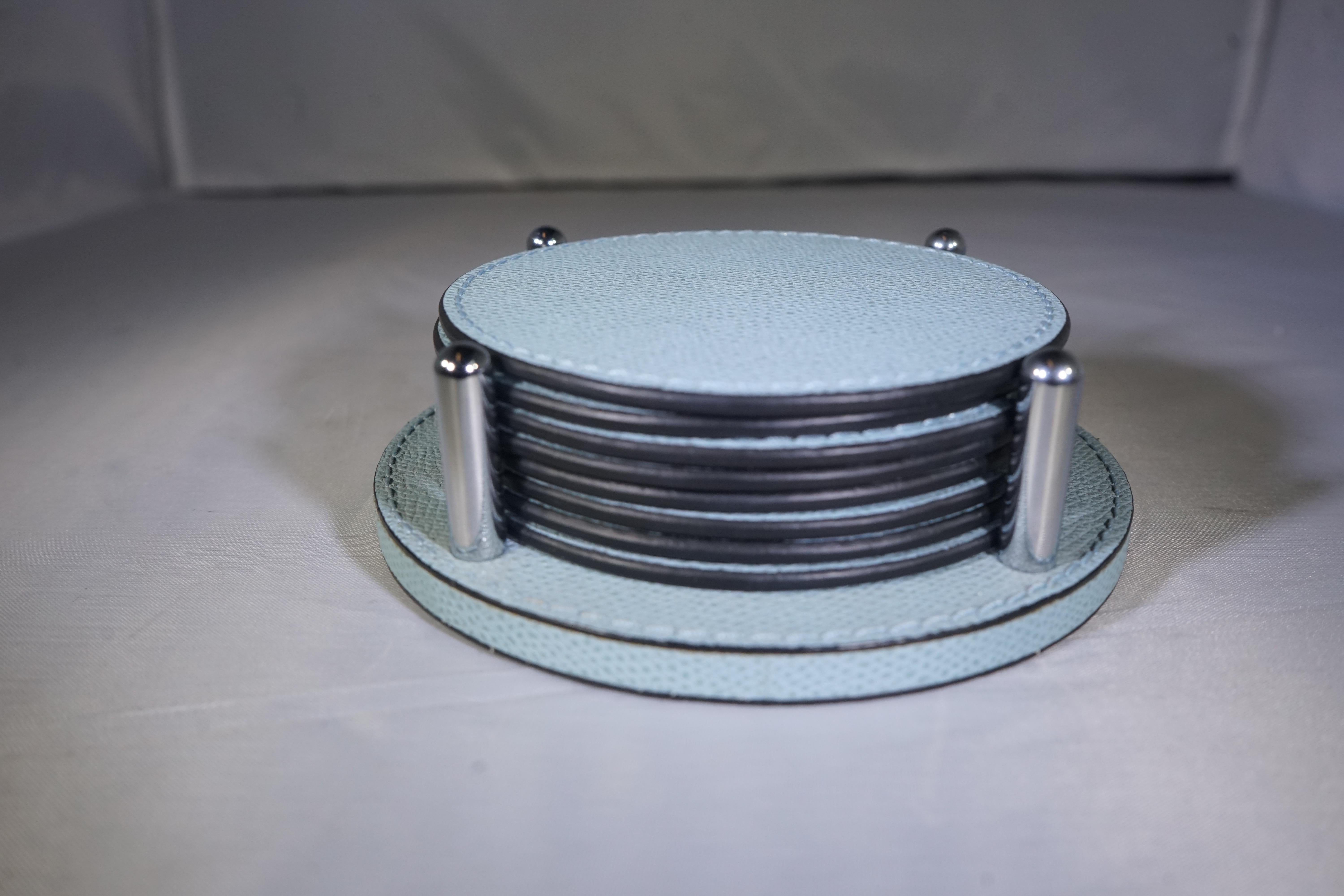 Contemporary Italian sky blue colored leather coaster set with 8 coasters and holder.