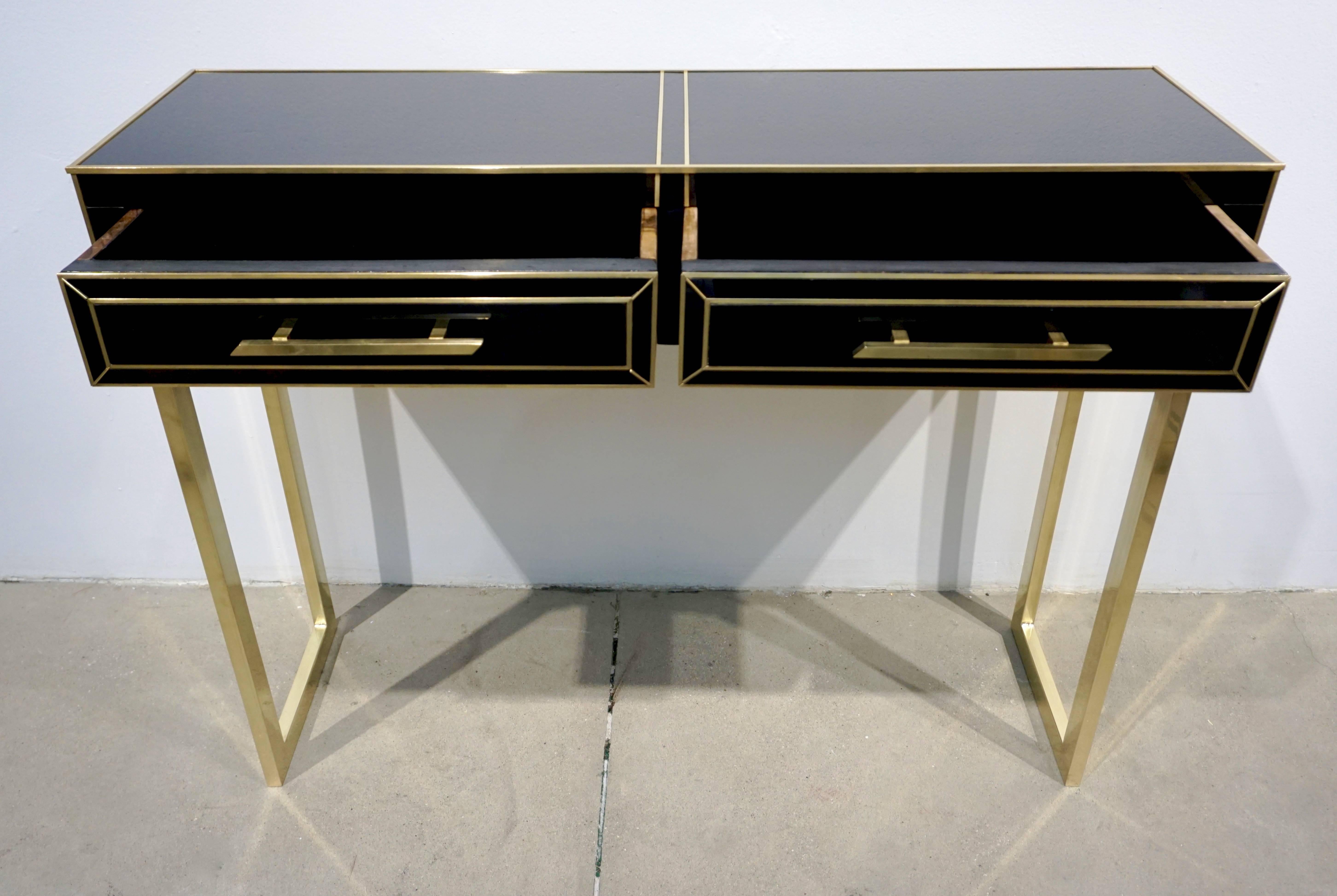 black console table with gold legs