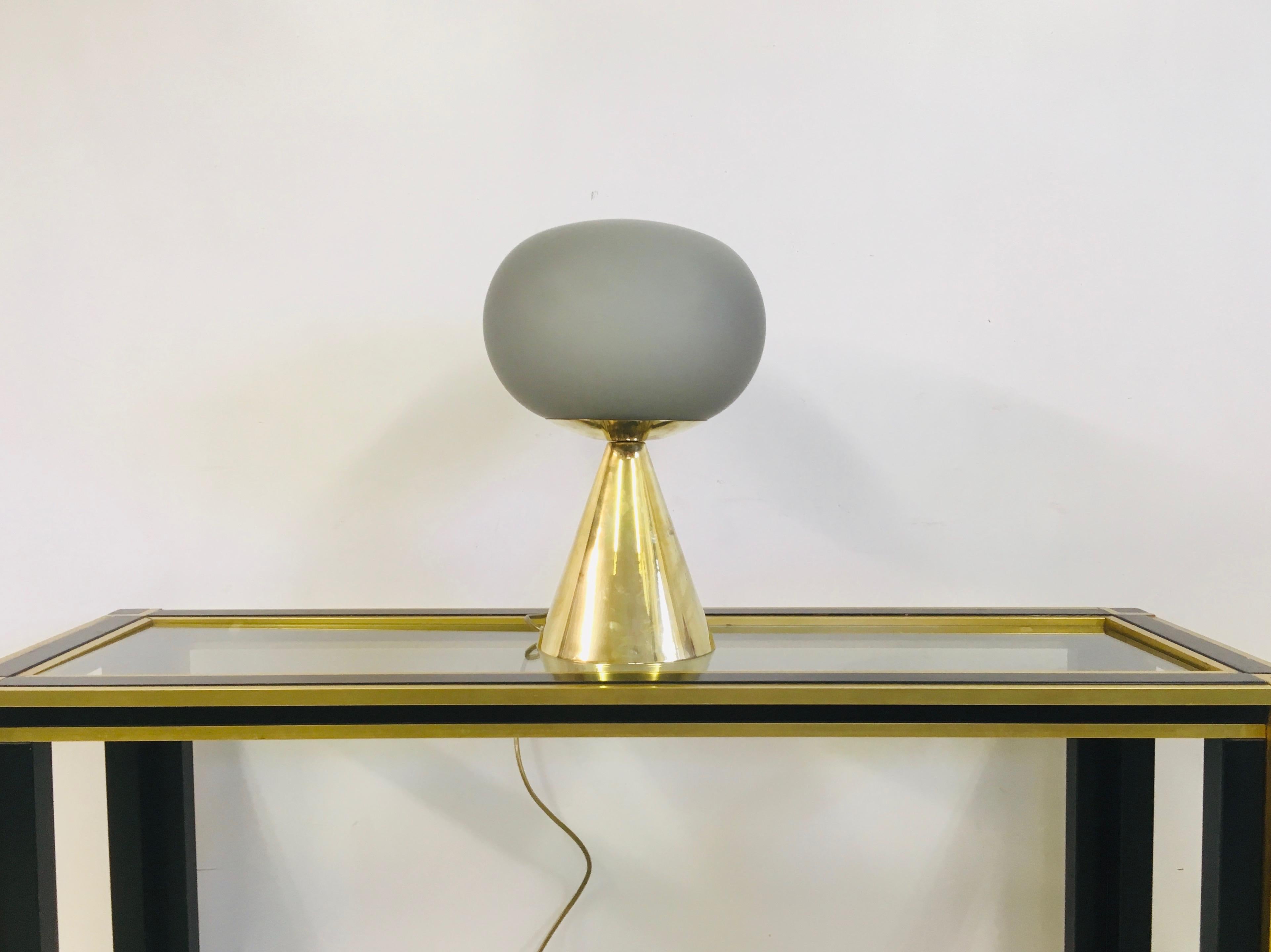 Grey glass and brass table lamp 

Can be ordered singular or in pairs etc.

Contemporary, Italy.