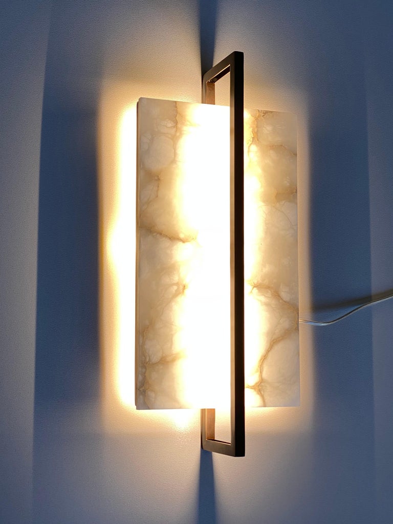 Cosulich Interiors & Antiques in collaboration with Matlight Italy: the Tile sconce, with its simple geometric minimal lines, has a very modern flavor that is in strong contrast with the more traditional materials used such as veined alabaster and a