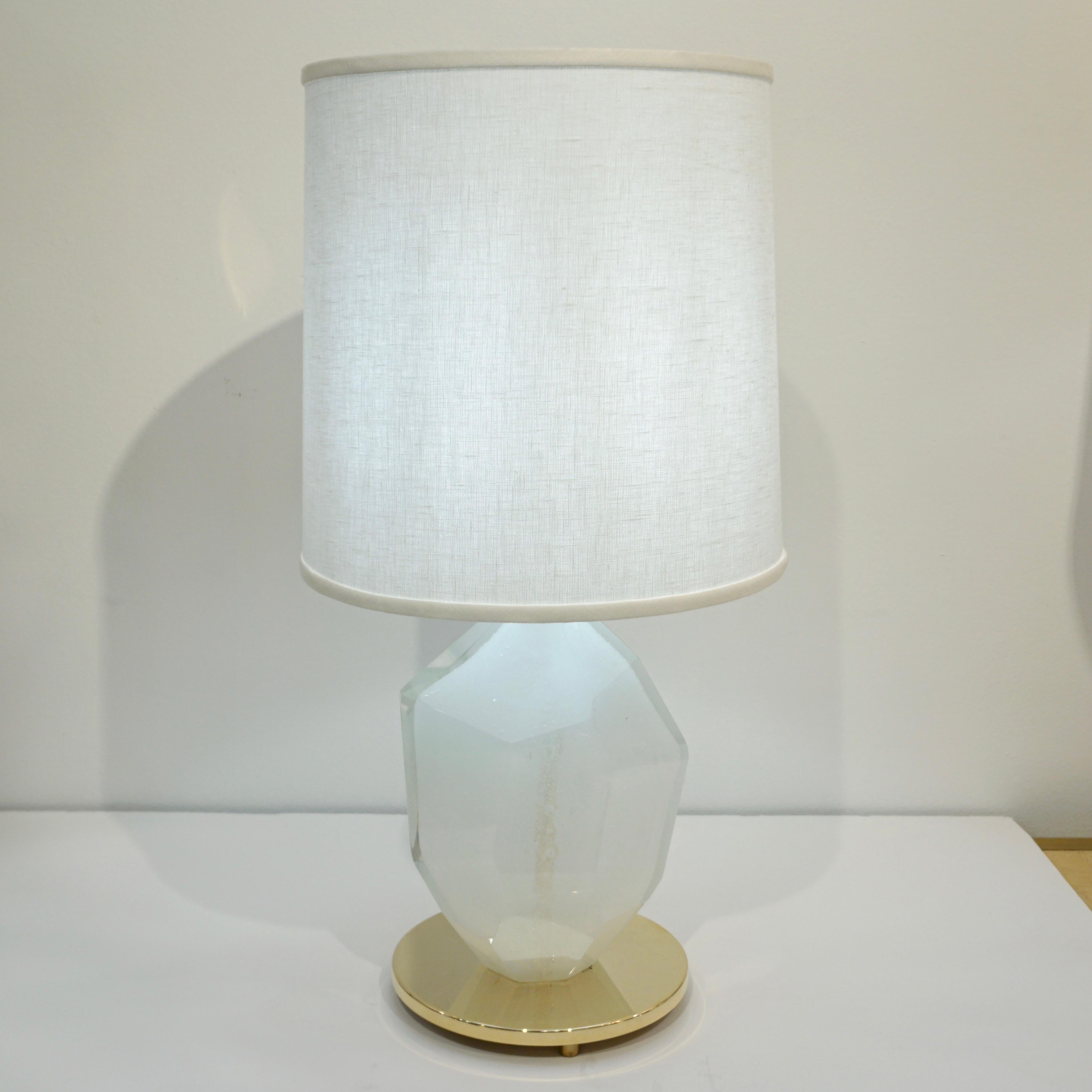 Contemporary made in Italy pair of table lamps, of organic design, signed by Alberto Donà Studio, high quality of execution, entirely handcrafted and hand polished. The heavy solid Murano glass bodies are worked in Pulegoso: lots of tiny air bubbles