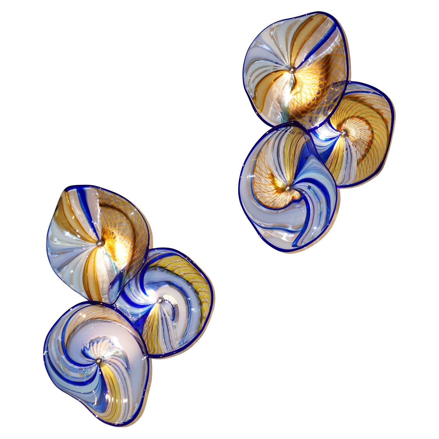 An exclusive pair of Venetian wall lights, entirely handcrafted in Italy, composed each of 3 freeform waved glass discs, Work of Art in blown Murano glass worked like a modern painting and preciously decorated with different techniques: canne,
