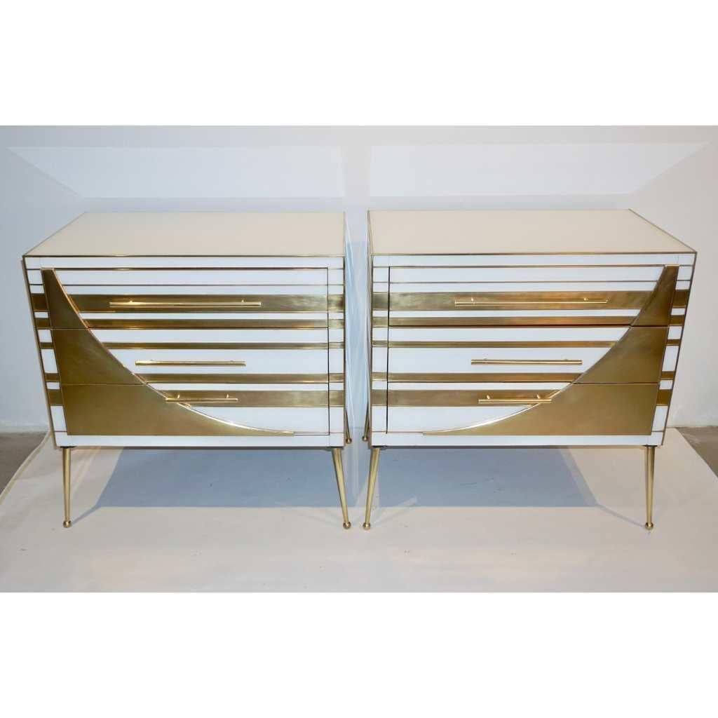 This Italian exclusive pair of modern chests, that can be used as end, side tables or nightstands, present a unique Art Deco Style fine design, quality of construction and use of mixed material techniques: metal and glass on wood. Entirely