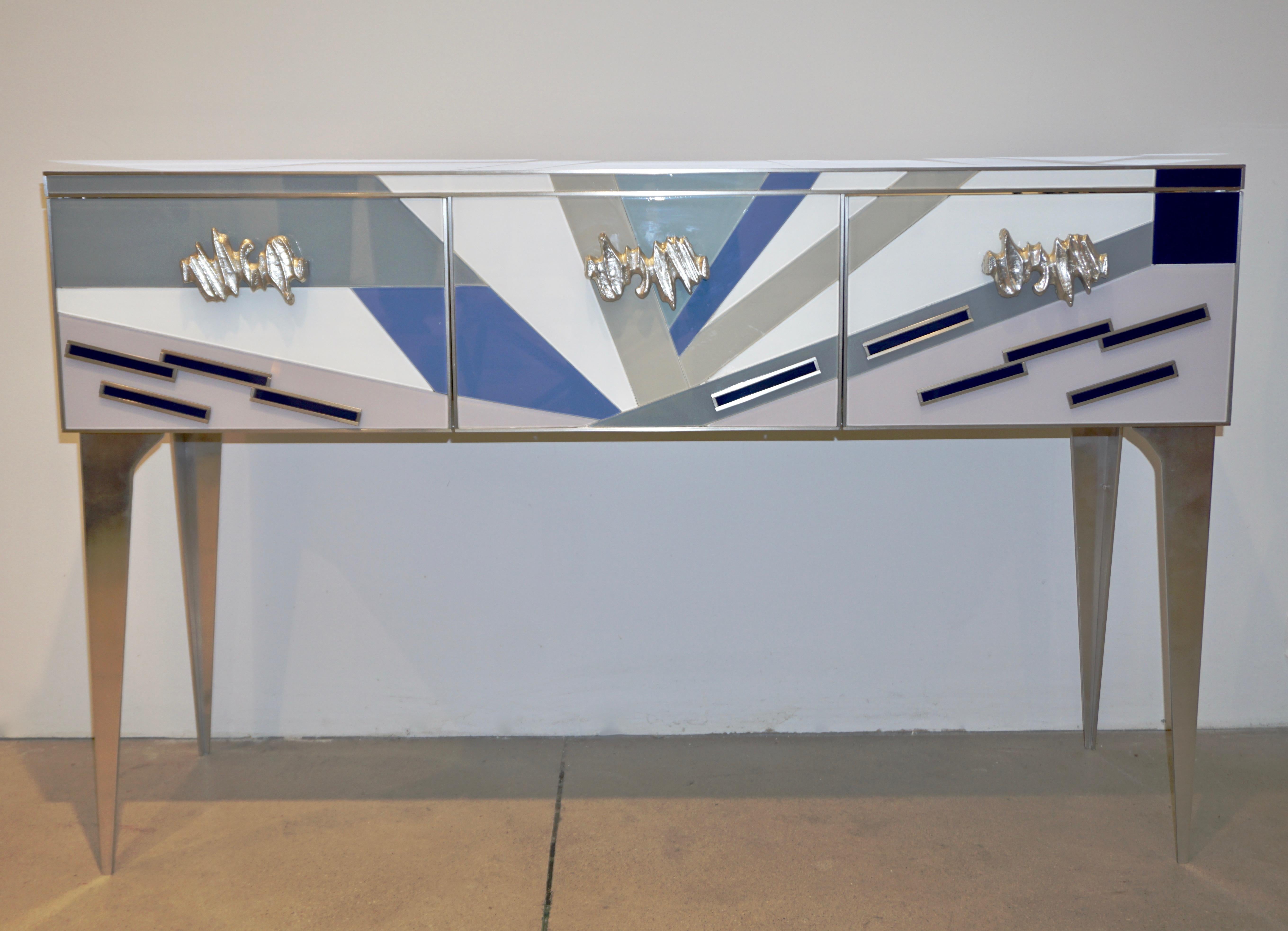 An interesting colorful piece with Pop Art flair, very fun Italian modernist credenza/cabinet with the advantage of a shallow body, 3 front panel design with fixed center panel and 2 side doors, highlighted with nickel trims. The very enticing