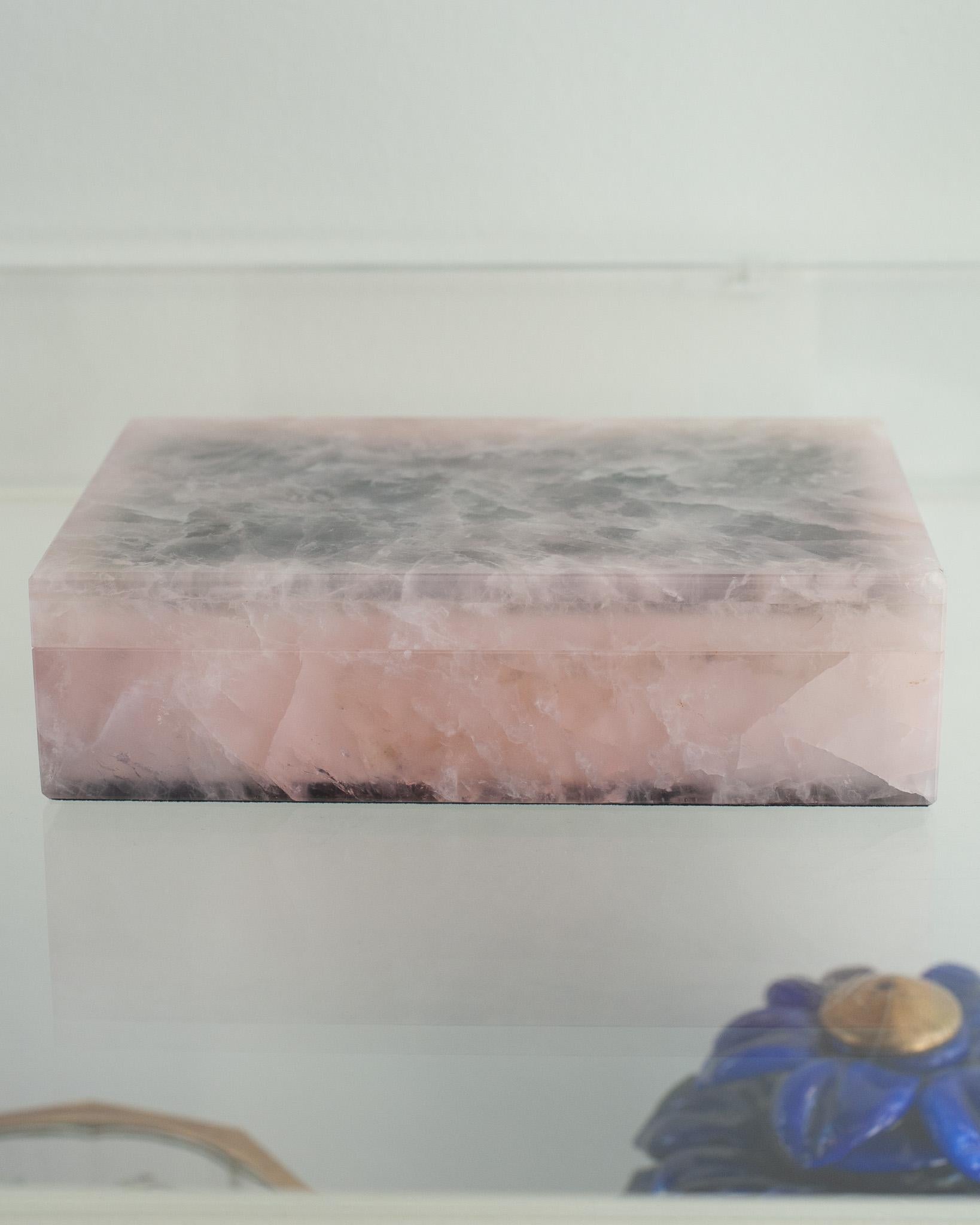 Invite healing energy into your home with an exquisite Rose Quartz box. This box is beautifully made with a hinged lid and expert construction. Lined in black velvet with white marble trims. Finished to a high polish to show off the natural beauty