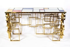 Tavolo consolle scultoreo italiano contemporaneo con piano in vetro e ottone