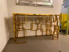 Console italienne contemporaine sculpturale en laiton et plateau en verre