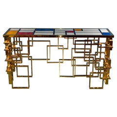 Console italienne contemporaine sculpturale en laiton et plateau en verre