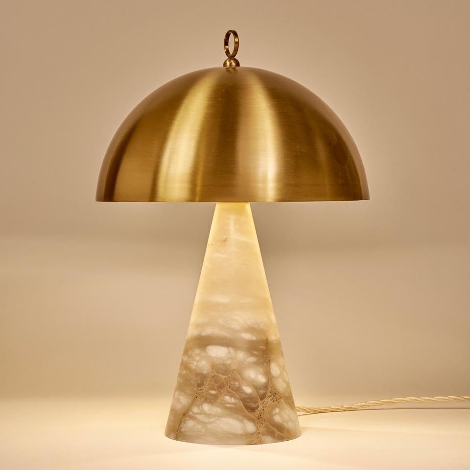The compact size of this table lamp makes it a perfect choice for smaller spaces or as an accent piece on bedside tables or wall cabinets. Despite its small size, the lamp's design is visually striking and impactful, with the veins of the natural