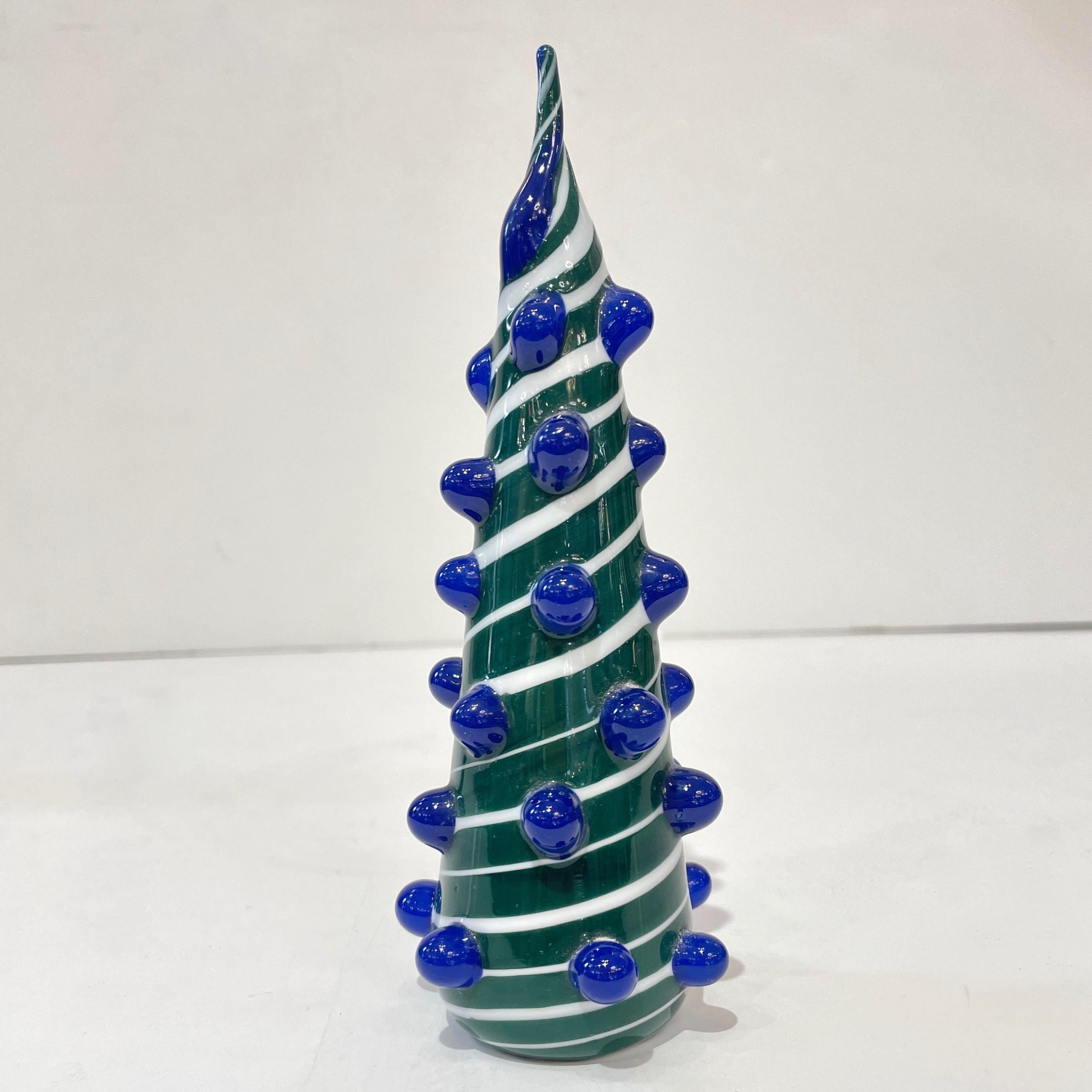Modern Murano glass tree of minimalist design, a creation labeled Galliano Ferro Murano, individually mouth-blown and handcrafted, part of a collection assembled by Cosulich Interiors & Antiques. The solid cone in pine green Murano glass is blown