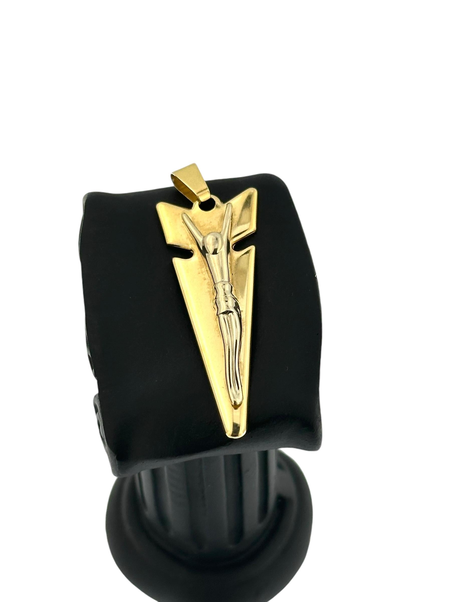 This Contemporary Italian Crucifix is an innovative and stylized piece, crafted in 18kt yellow and white gold with a sleek, modern aesthetic. The crucifix itself is designed to resemble the shape of an arrow, symbolizing guidance, direction, and