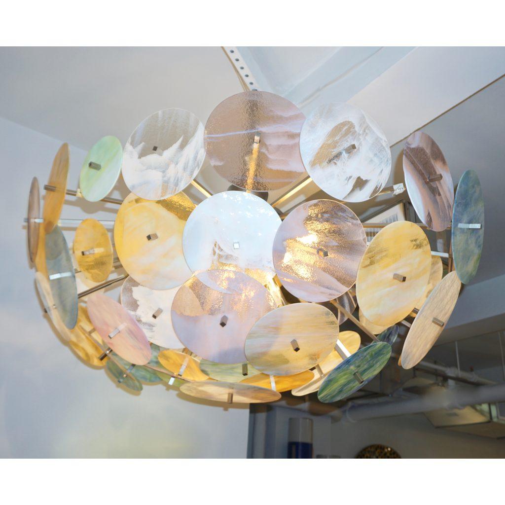 Contemporary Italian custom-made Sputnik chandelier / flush mount of oval shape, entirely handcrafted, an enticing modern design. The structure, with a special hand-painted tarnished silver color artistic finish, is composed of a central half-sphere