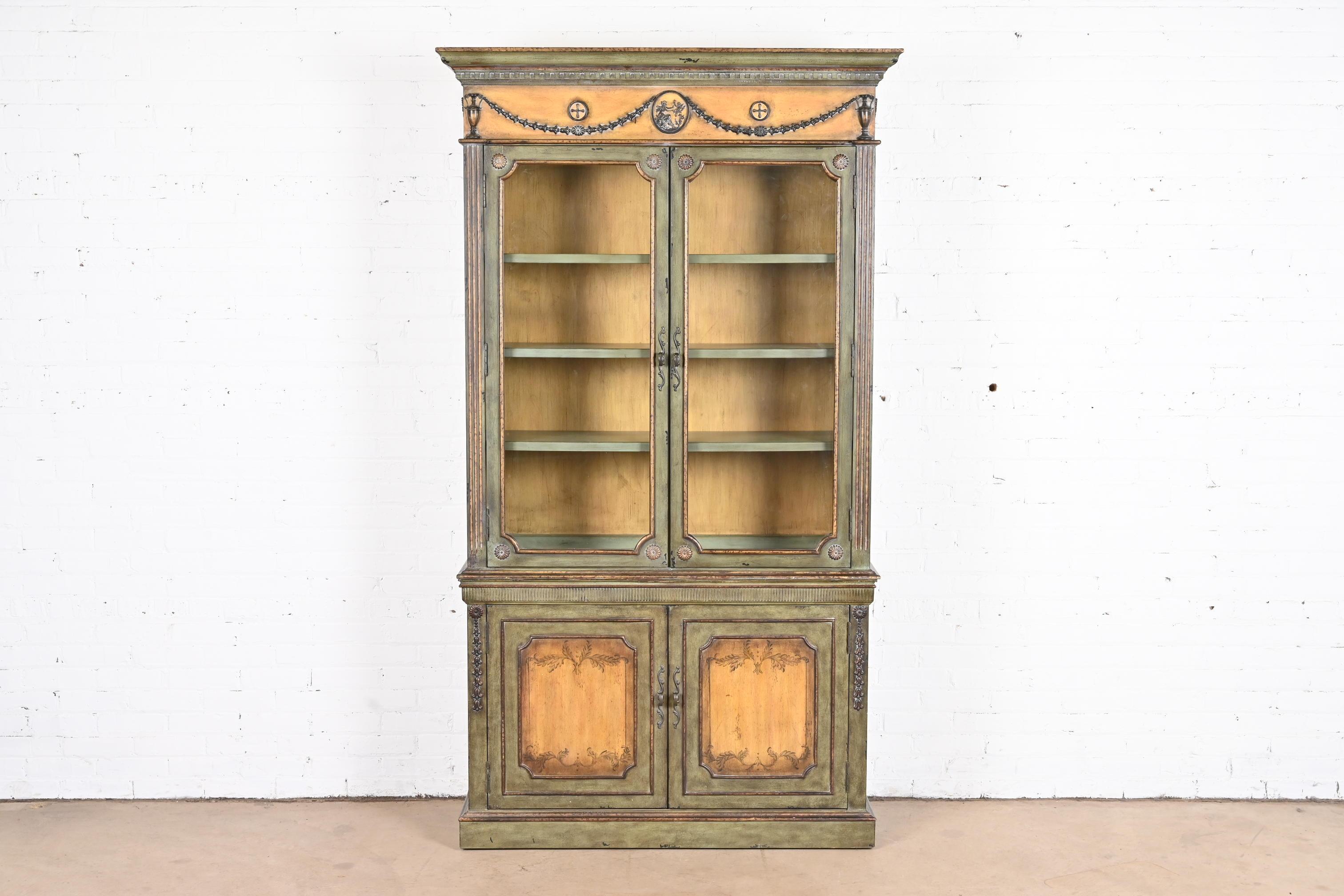 A gorgeous contemporary neoclassical Italianate breakfront bookcase cabinet

circa late 20th century

Carved and painted wood, with glass front doors.

Measures: 48
