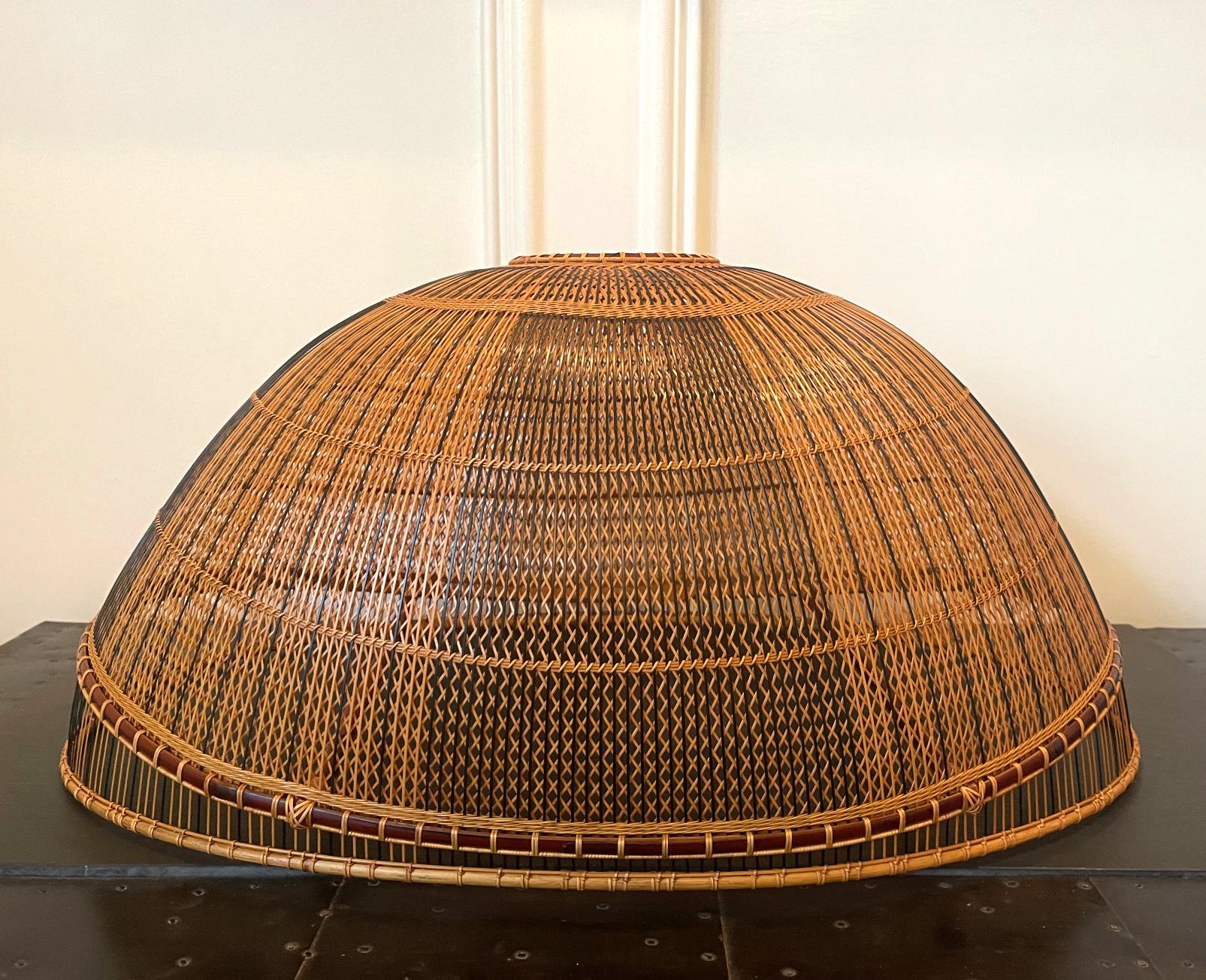 A contemporary Japanese bamboo sculpture entitled Light at Dawn (Gyoko) made in 2004 by Kawano Shoko (B. 1957). This airy piece is unconventional in form for not being a basket but a pure none-functional sculptural form. Constructed with madake,