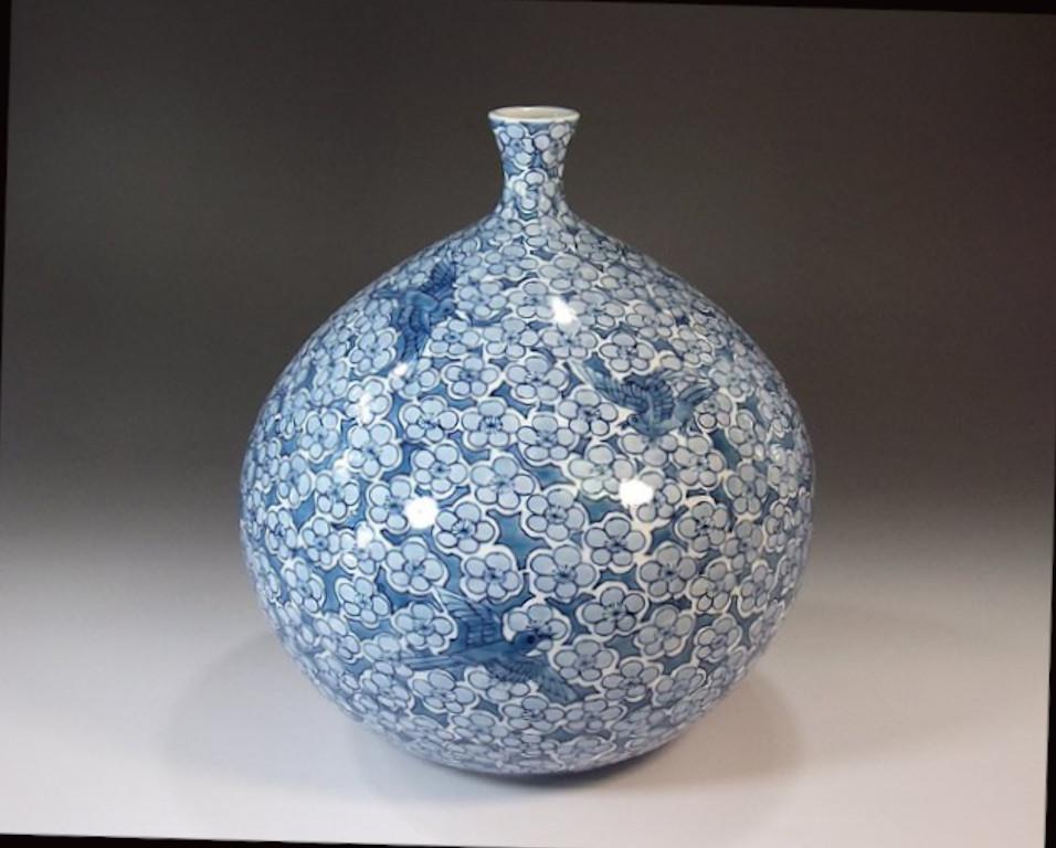 Unique Japanese contemporary decorative porcelain vase, intricately hand painted in cobalt blue underglaze on an elegantly shaped porcelain body, a signed work by respected award-winning master porcelain artist from the historic Imari-Arita region