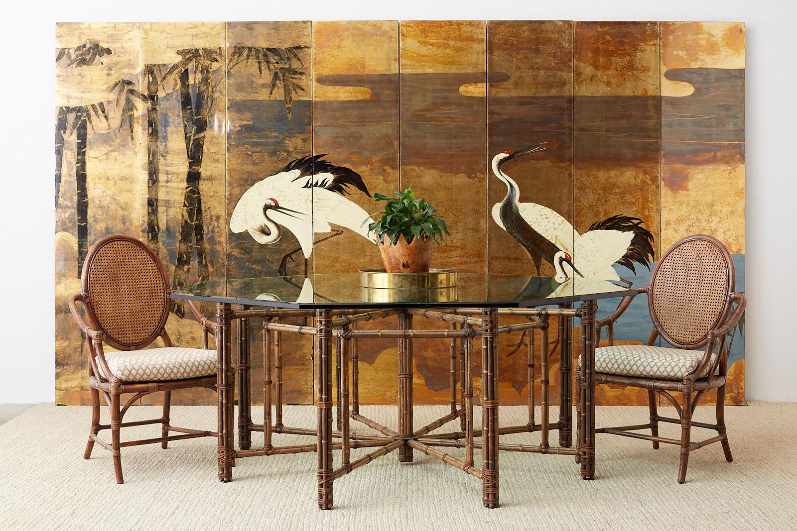 Monumental contemporary Japanese eight panel screen featuring a three crane landscape scene. Painted on squares of gold leaf in an Edo period Kano School style and manner. Each panel has a high gloss lacquer finish with an ebonized finish on the
