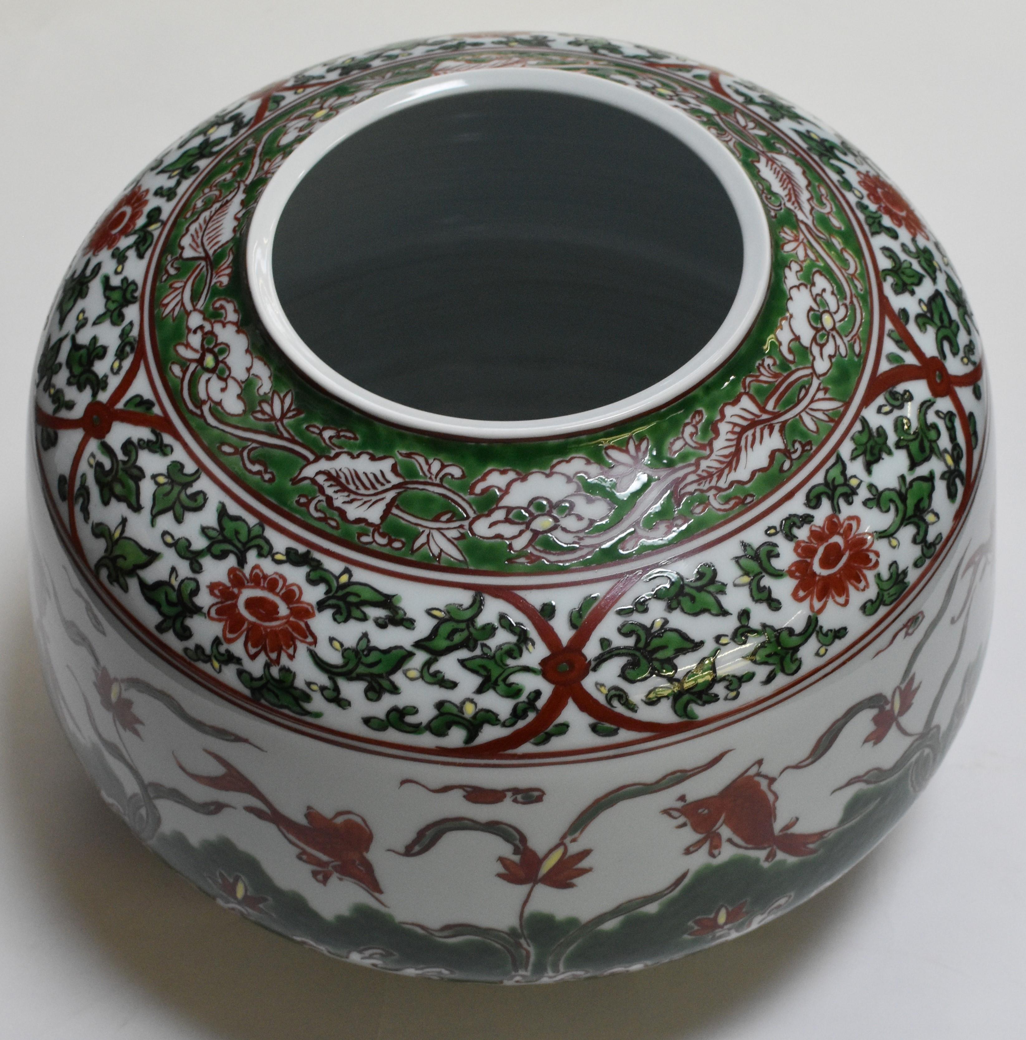 Exceptional large Japanese contemporary decorative porcelain vase, hand-painted in deep green and red on a beautifully shaped porcelain body, a masterpiece by acclaimed award-winning master porcelain artist from the Imari-Arita region in Japan. The