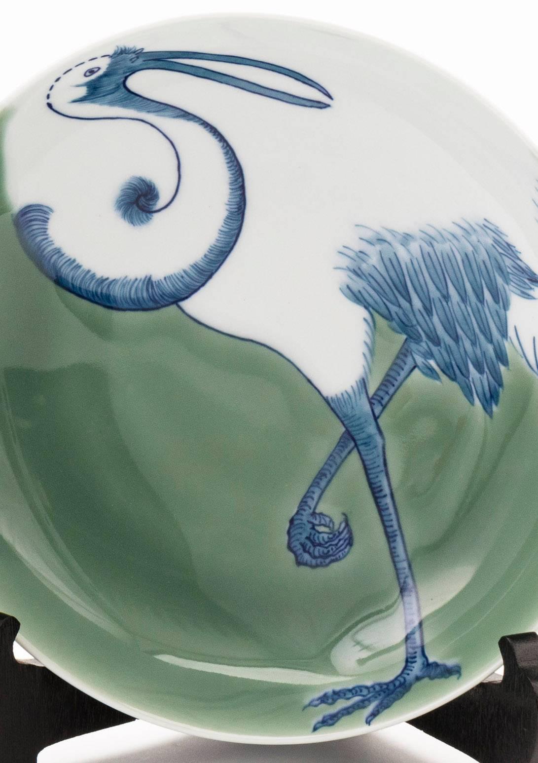 Contemporary Japanese Nabeshima porcelain plate with crane design on a celadon colored background.

Dimensions: H 6cm x D 21.5cm 

Please note: All ceramic items purchased from Kazari will require professional packaging to ensure safe transport