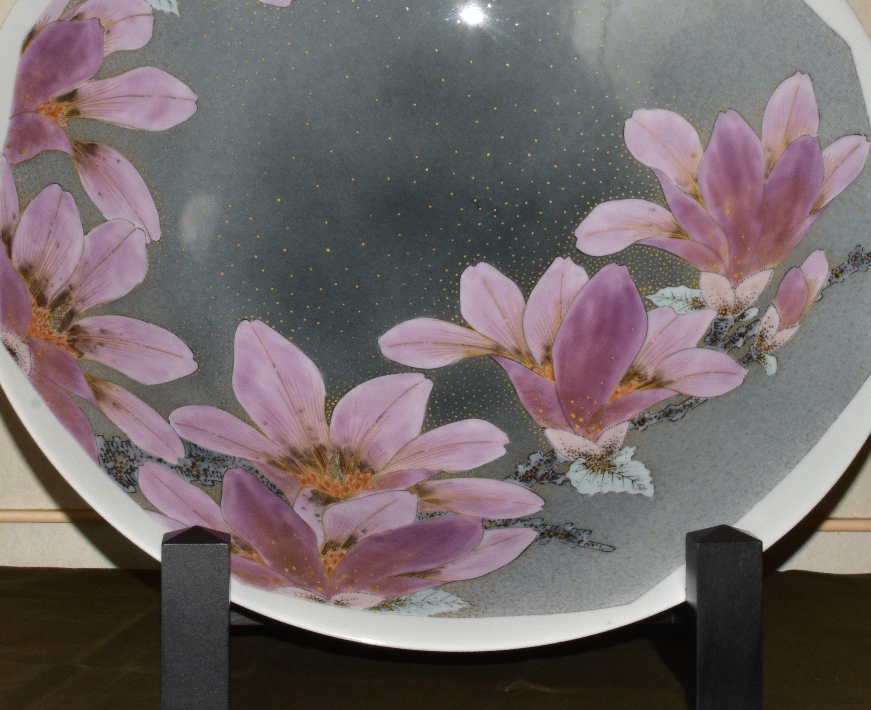 Exceptional Japanese contemporary museum-quality large decorative porcelain deep charger/centerpiece dramatically hand-painted showcasing bold pink/purple magnolia flowers in full bloom set against a beautiful background of stunning gradations in