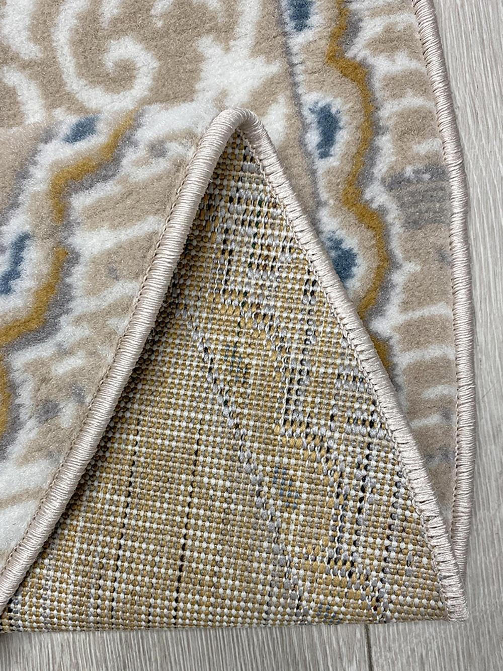 This contemporary Kazakh rug features a modern design with classic patterns in a sophisticated oval shape. Machine-made from high-quality polypropylene, this lightweight rug showcases a refined color palette of beige and gray.

Features:

Type: