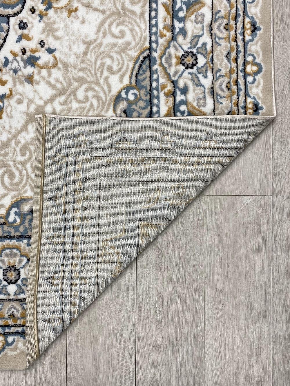 This beautiful contemporary Kazakh rug features a classic Tabriz style design, crafted with intricate patterns that add a touch of elegance to any room. Machine-made from high-quality polypropylene, this lightweight rug in beige and gray offers a