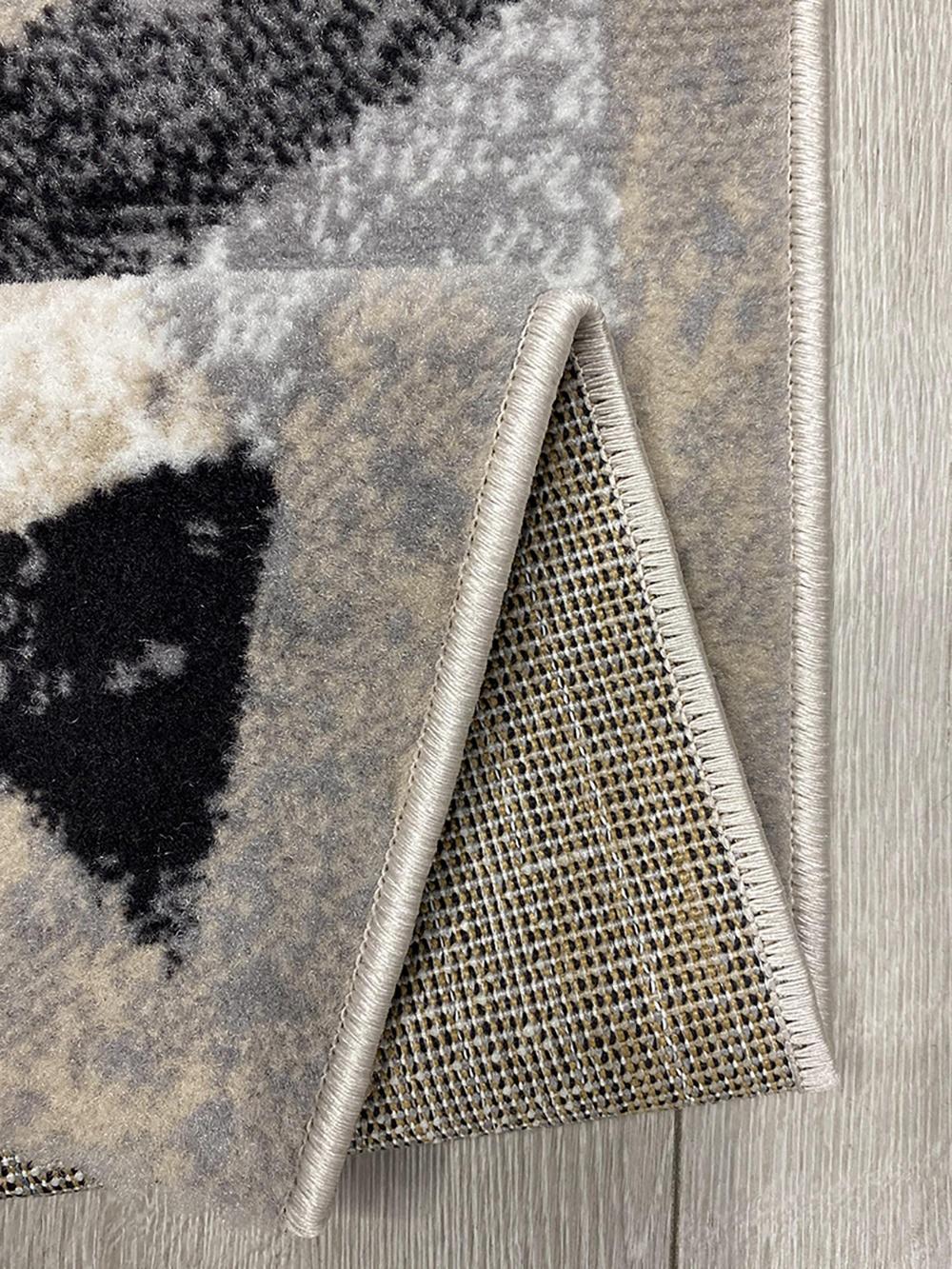 This contemporary Kazakh rug features a modern design with abstract and geometric patterns, perfect for enhancing any room's decor. Machine-made from high-quality polypropylene, this lightweight rug comes in a versatile gray color.

Features:

Type: