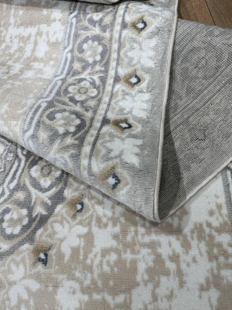 This contemporary Kazakh rug features a modern design with a blend of classic and contemporary patterns, ideal for enhancing any room's decor. Machine-made from a high-quality blend of cotton and polypropylene, this lightweight rug showcases a